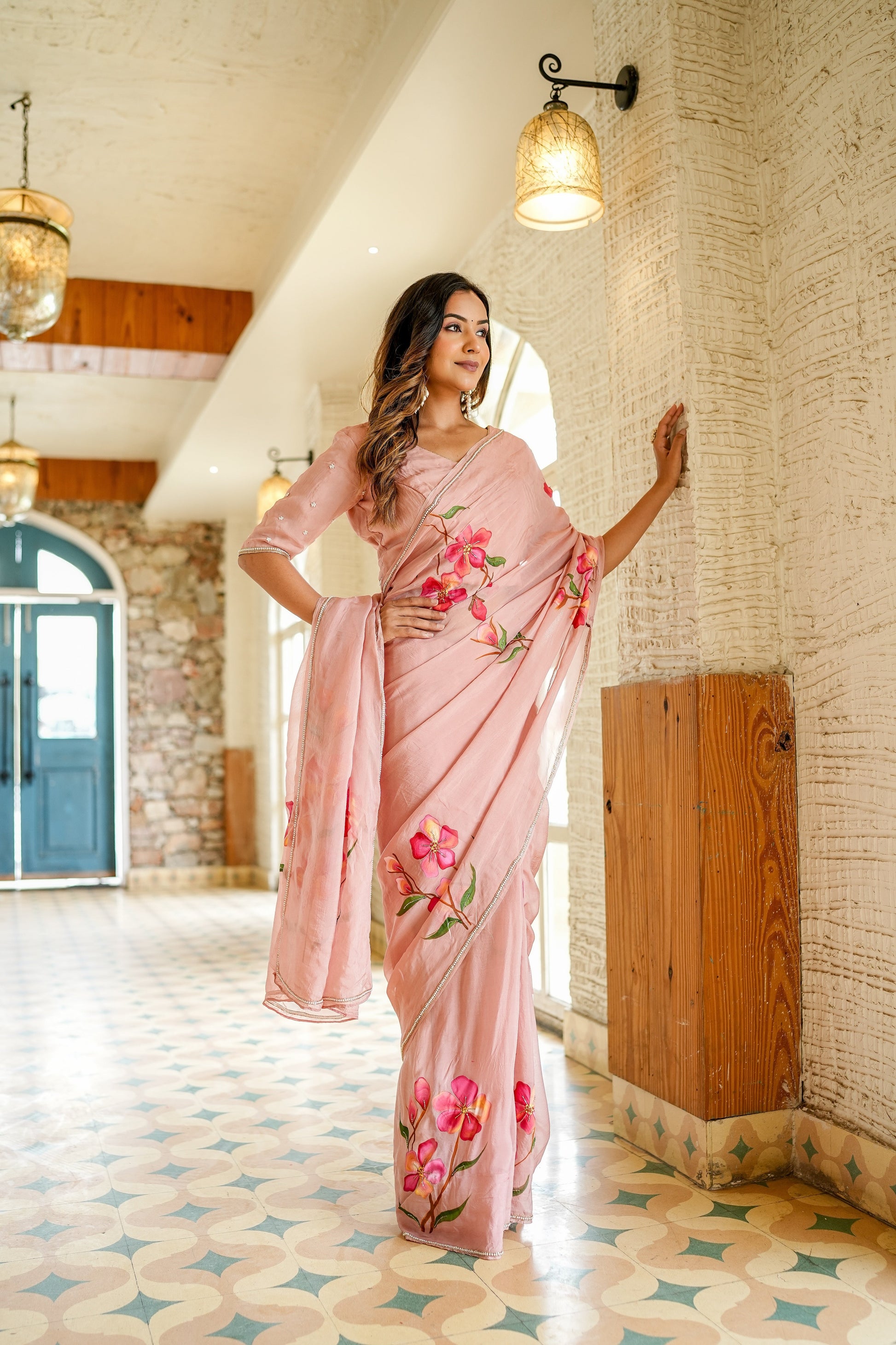 Stylera luxury statement saree for special occasions in soft pink with floral prints