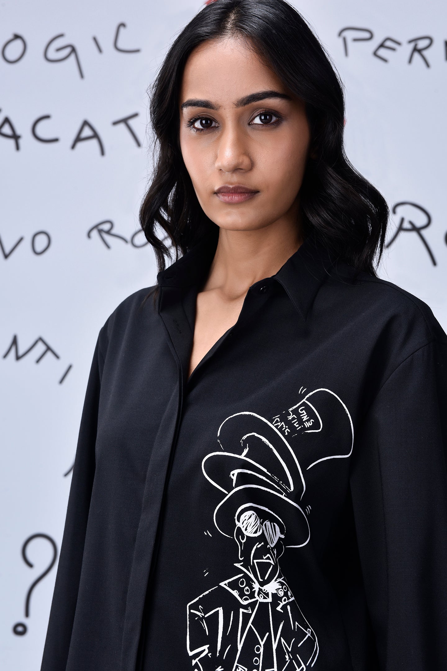 Stylera black button up shirt featuring white Mad Hatter illustration worn by model Mad Hatter wool shirt