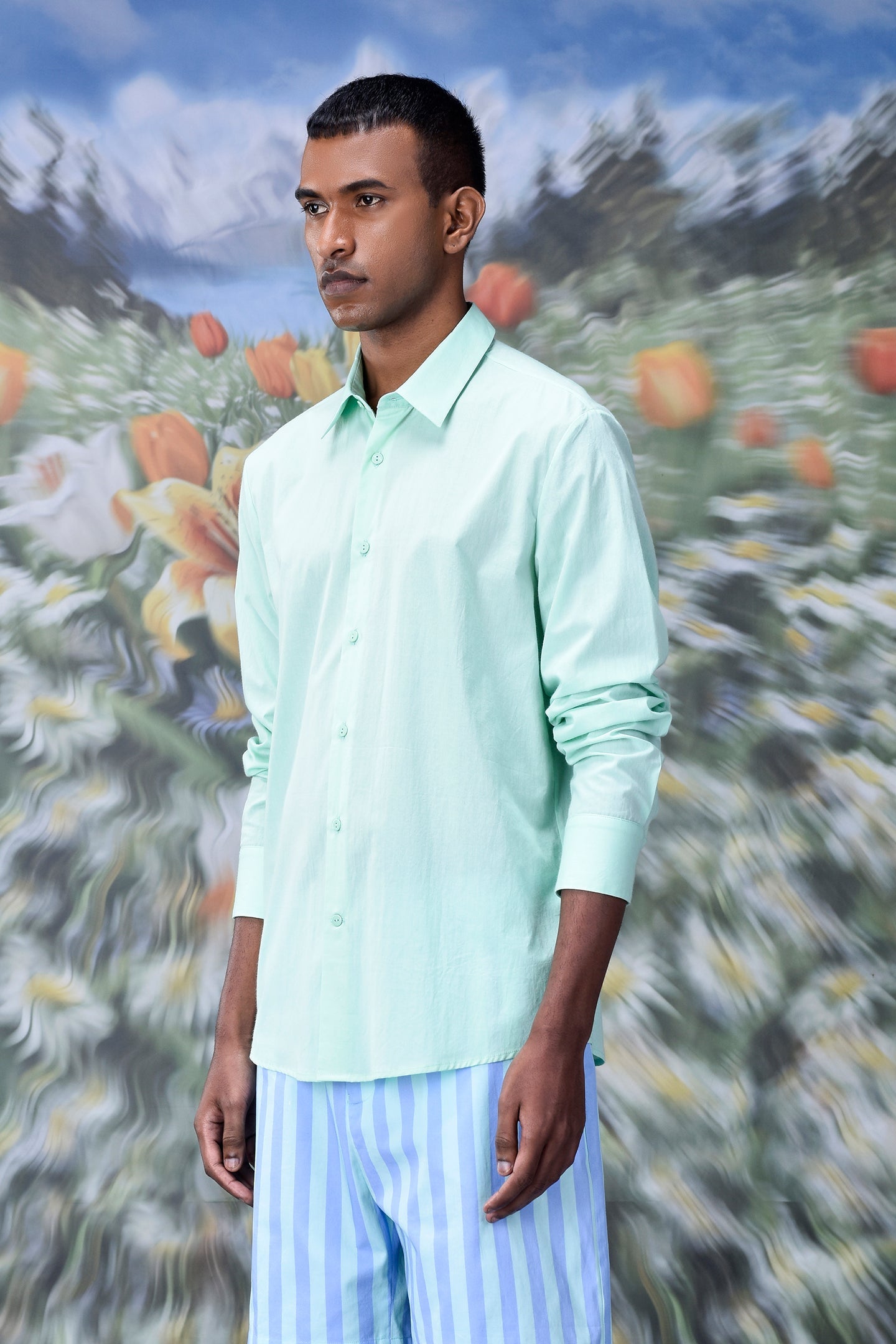 Stylera model wearing mint green button down malmal regular fit formal shirt with long sleeves