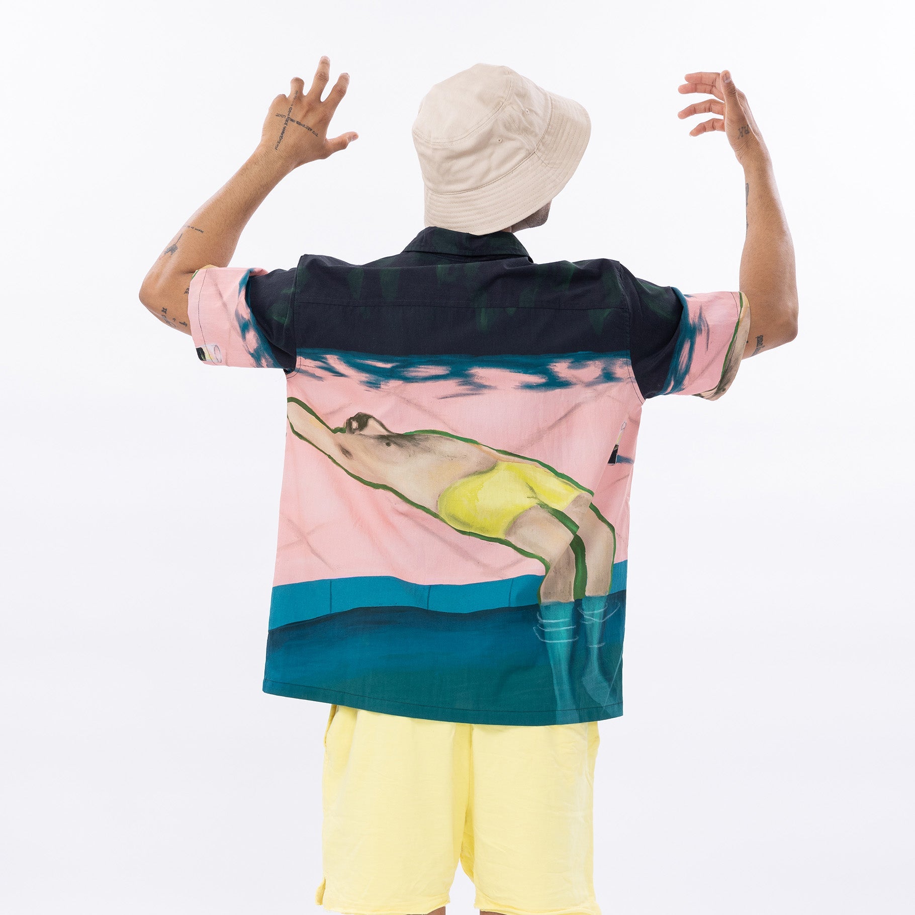 Stylera men's graphic short sleeve shirt featuring a swimmer design on a colorful background