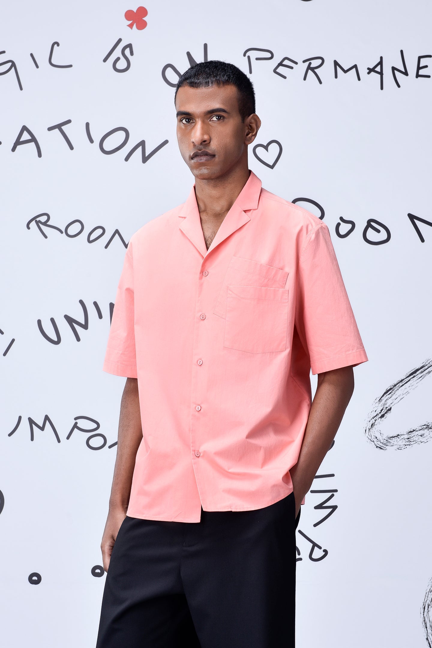 Men wearing a pink mens overlapping pocket shirt by Stylera with short sleeves