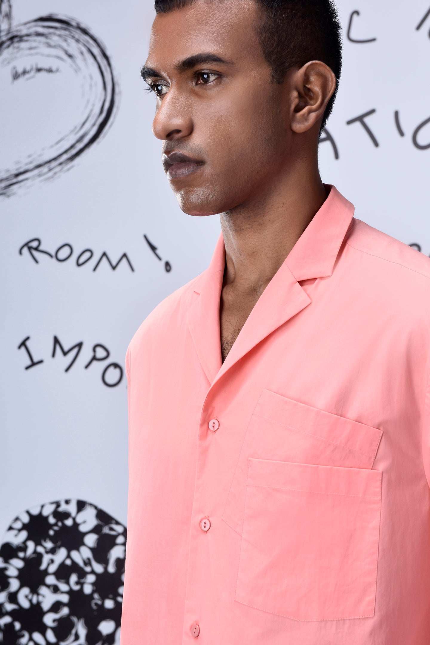 Stylera mens overlapping pocket shirt in pink worn by male model