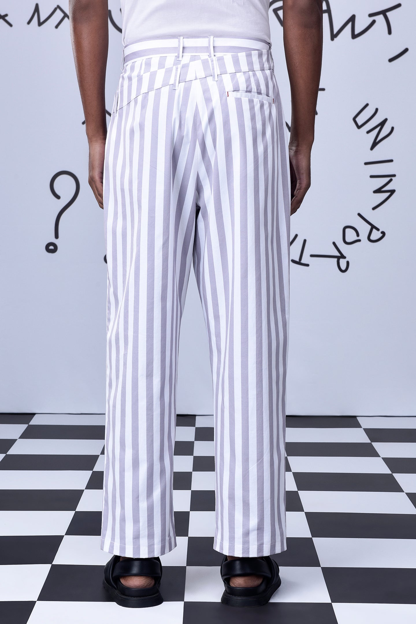 Back view of men's striped lounge pants by Stylera with vertical white and gray stripes