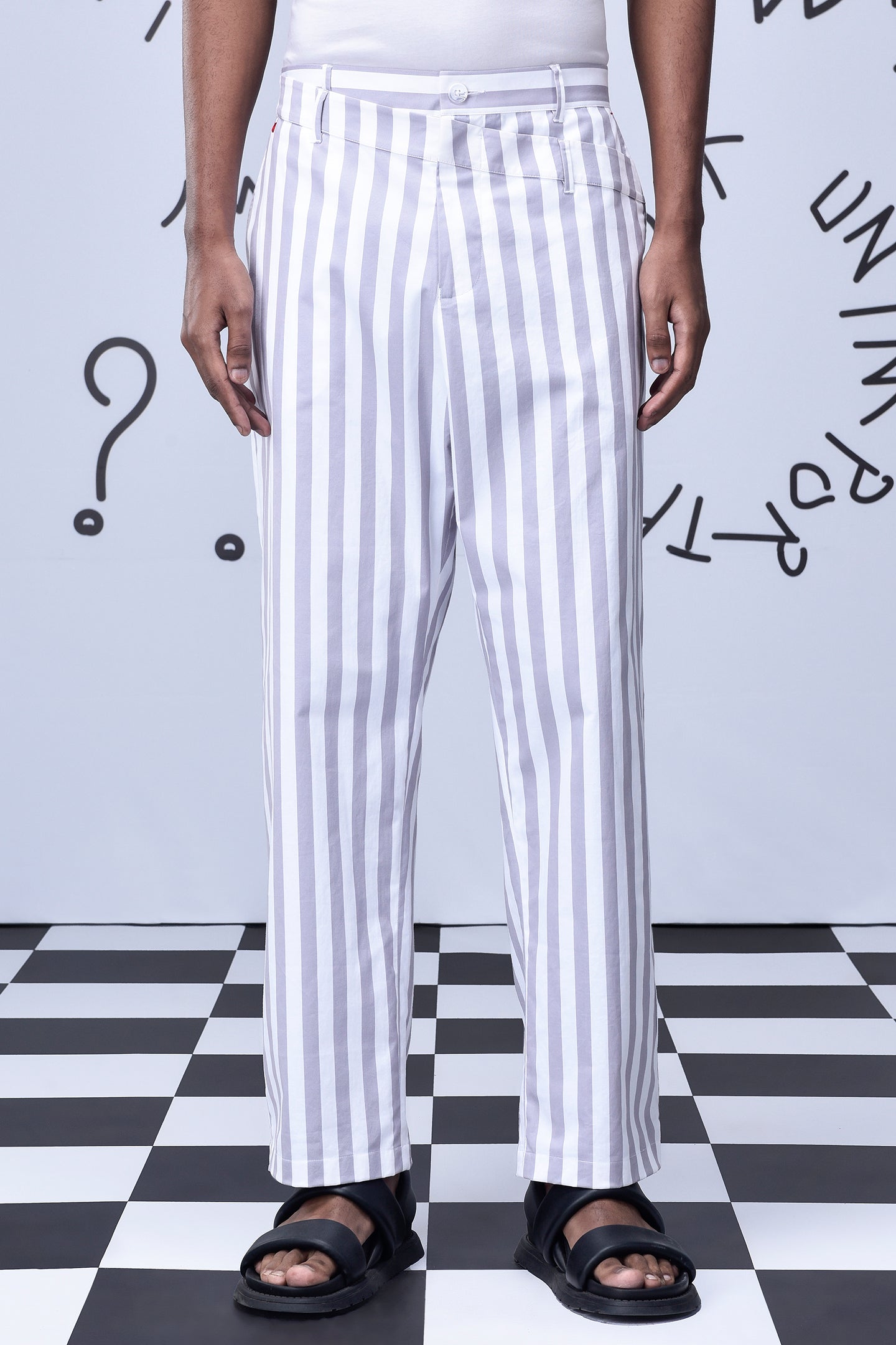 Stylera men's striped lounge pants with white and gray vertical stripes styled with black sandals