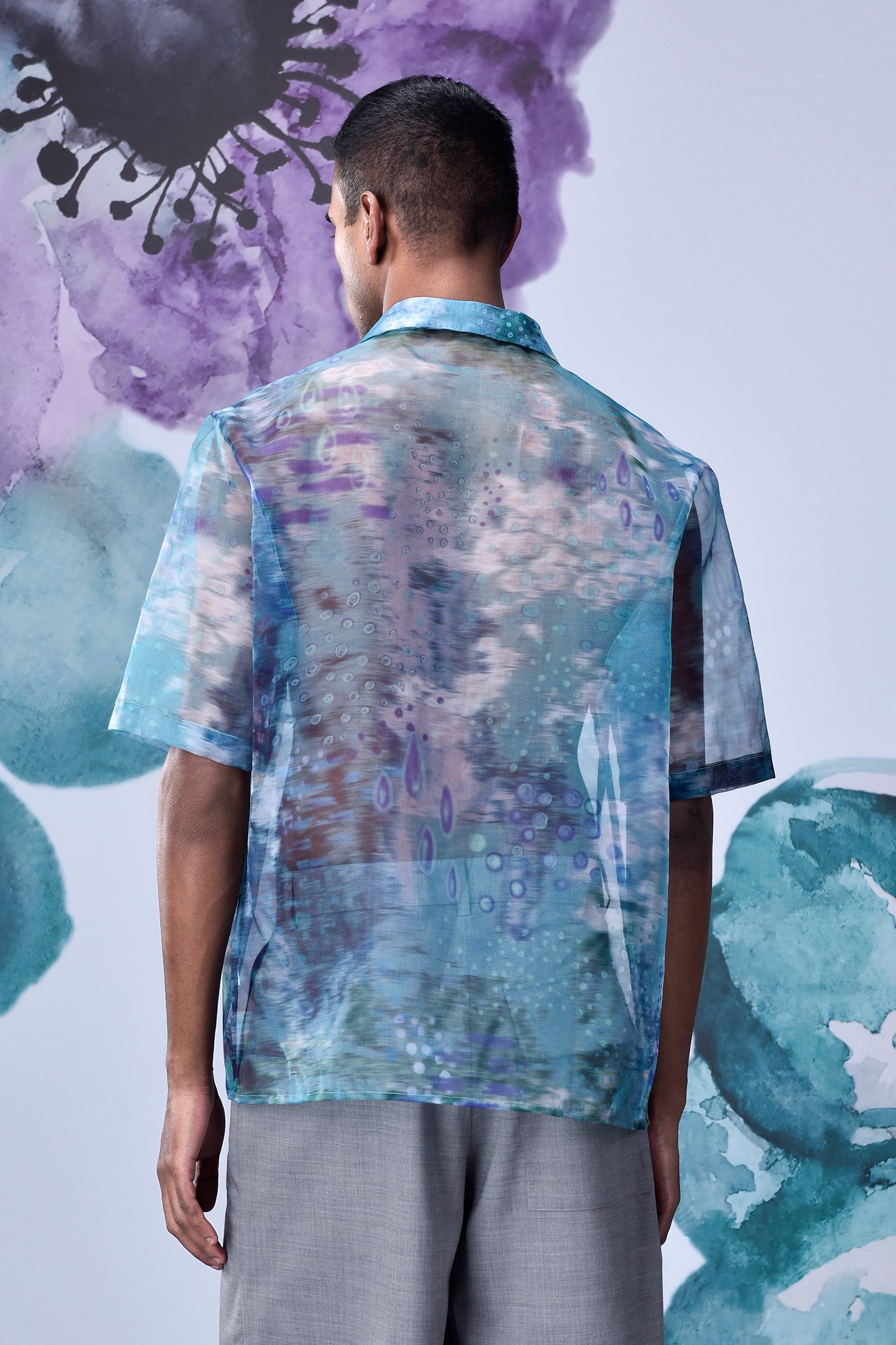 Back view of a men's summer organza shirt by Stylera in blue and purple abstract pattern