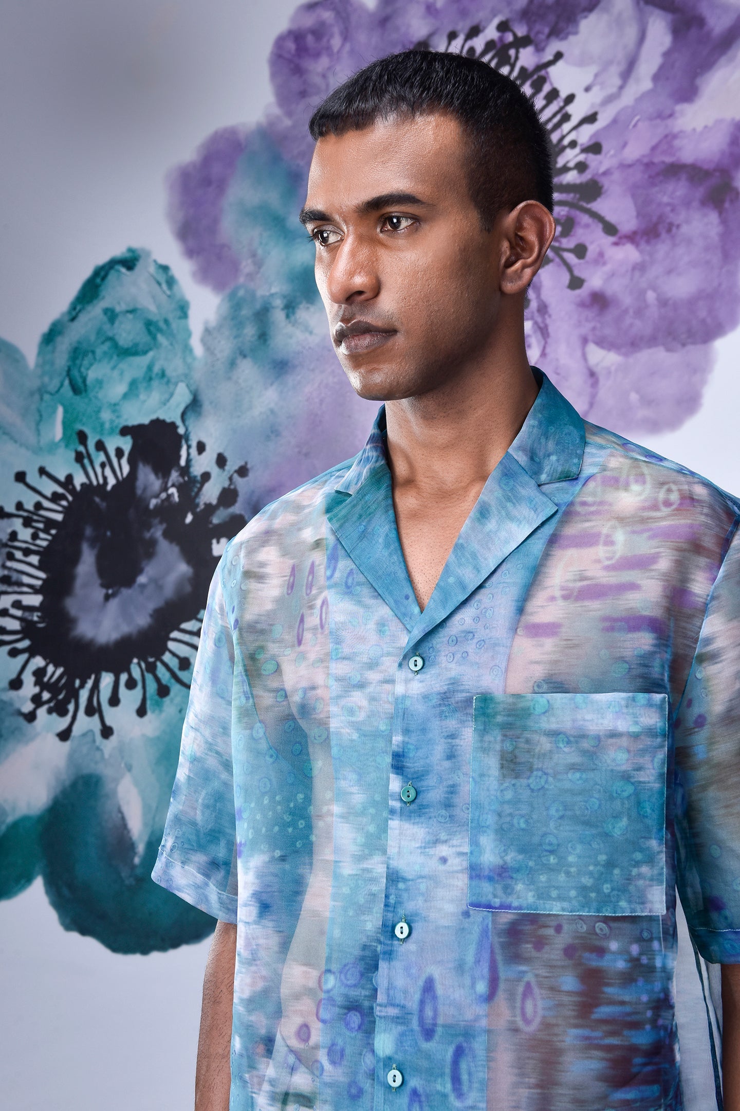 Men wearing Stylera men's summer organza shirt with blue and purple abstract floral design