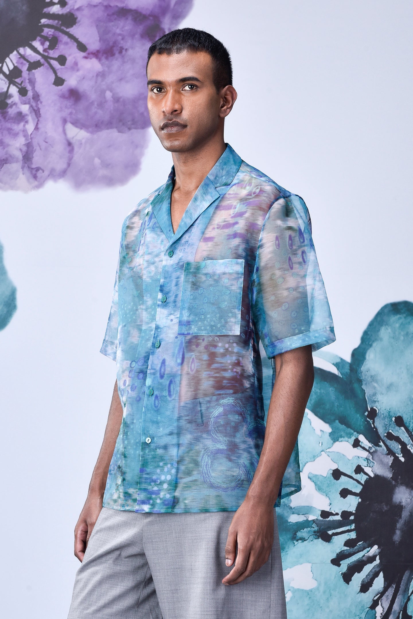 Men wearing a men's summer organza shirt by Stylera with blue abstract patterns