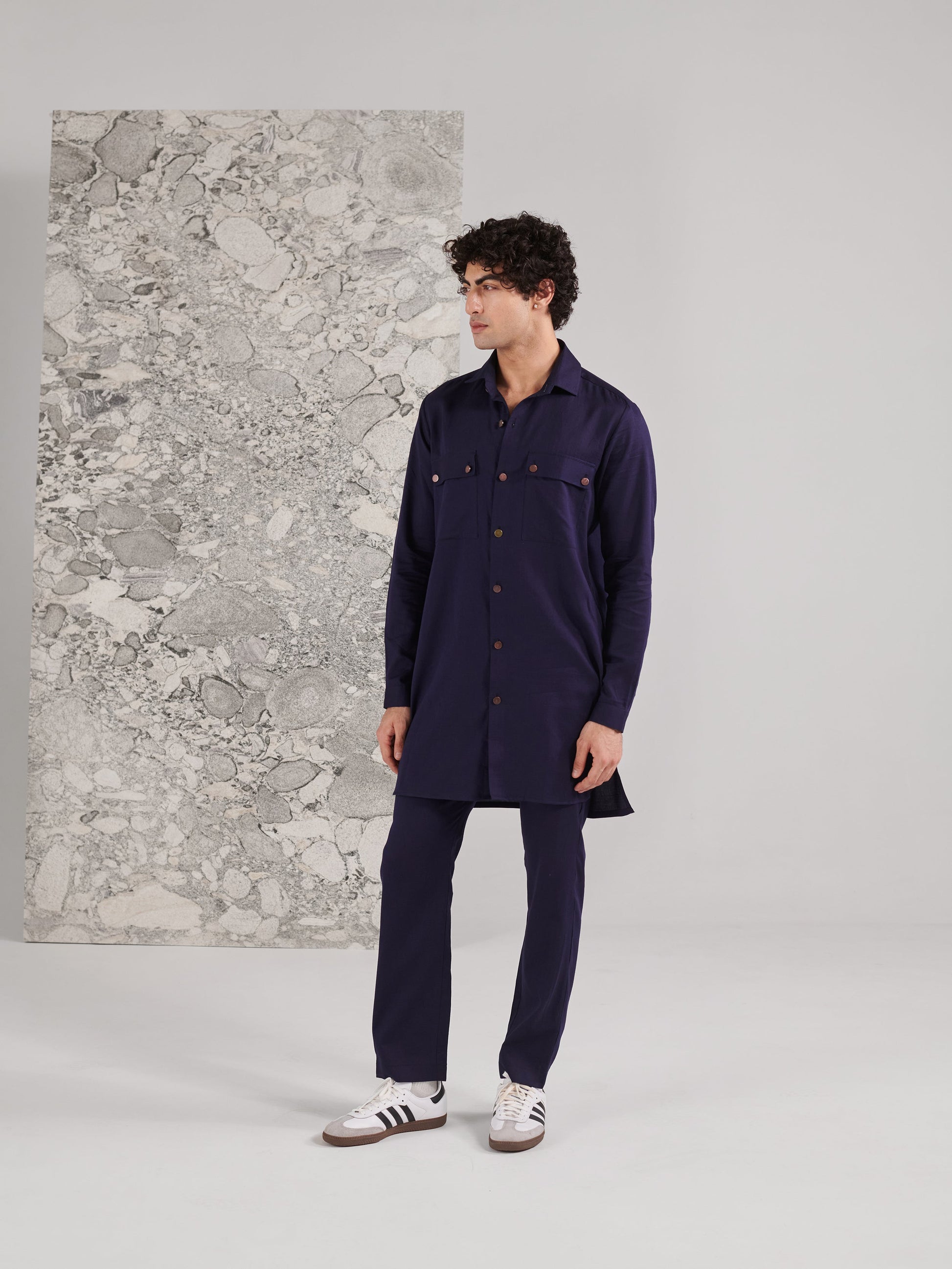 Men's traditional kurta pant set in navy blue with long sleeves and front pockets for a stylish look