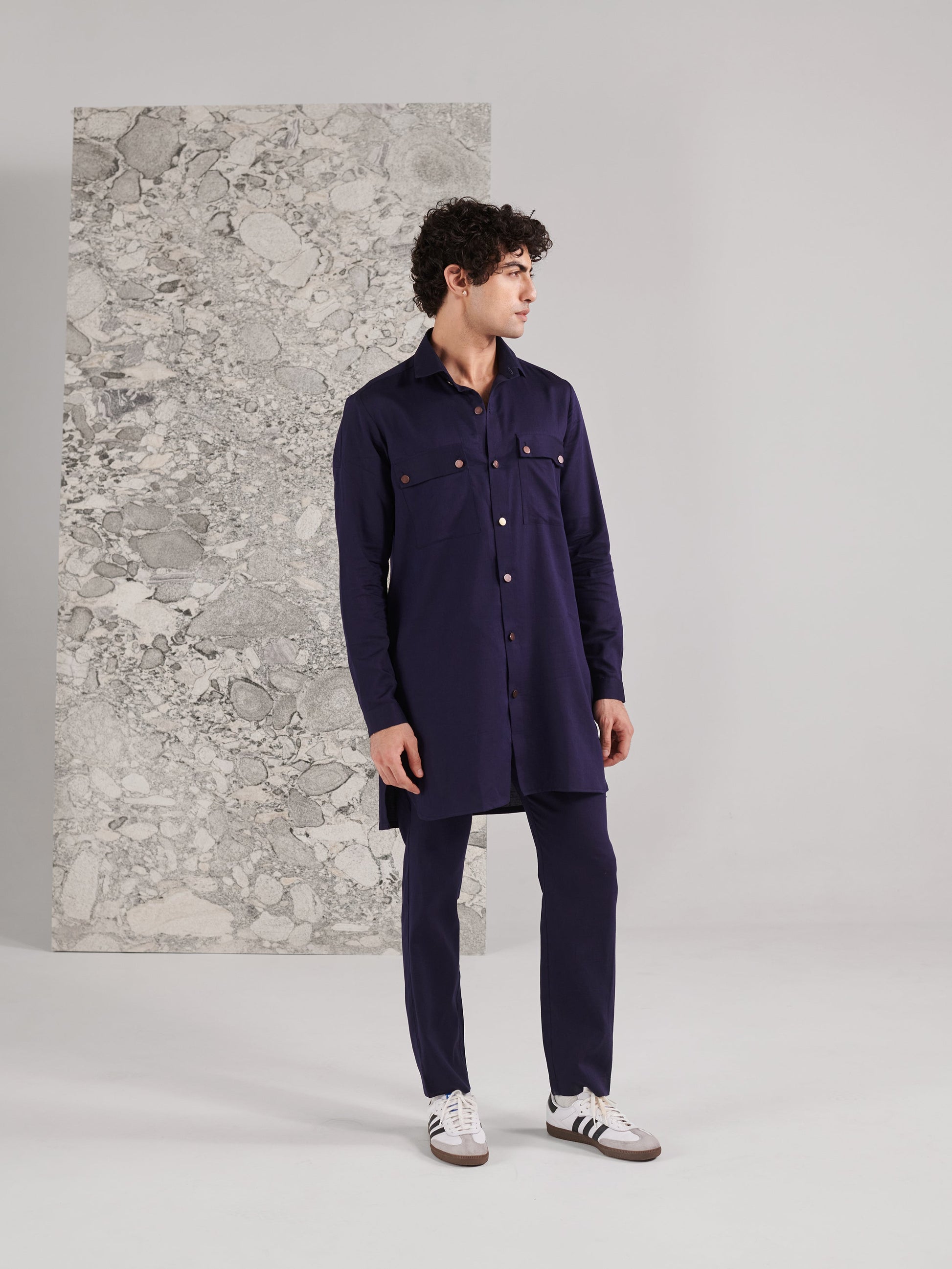 Stylish men's traditional kurta pant set in deep navy, featuring a button-down design and side pockets