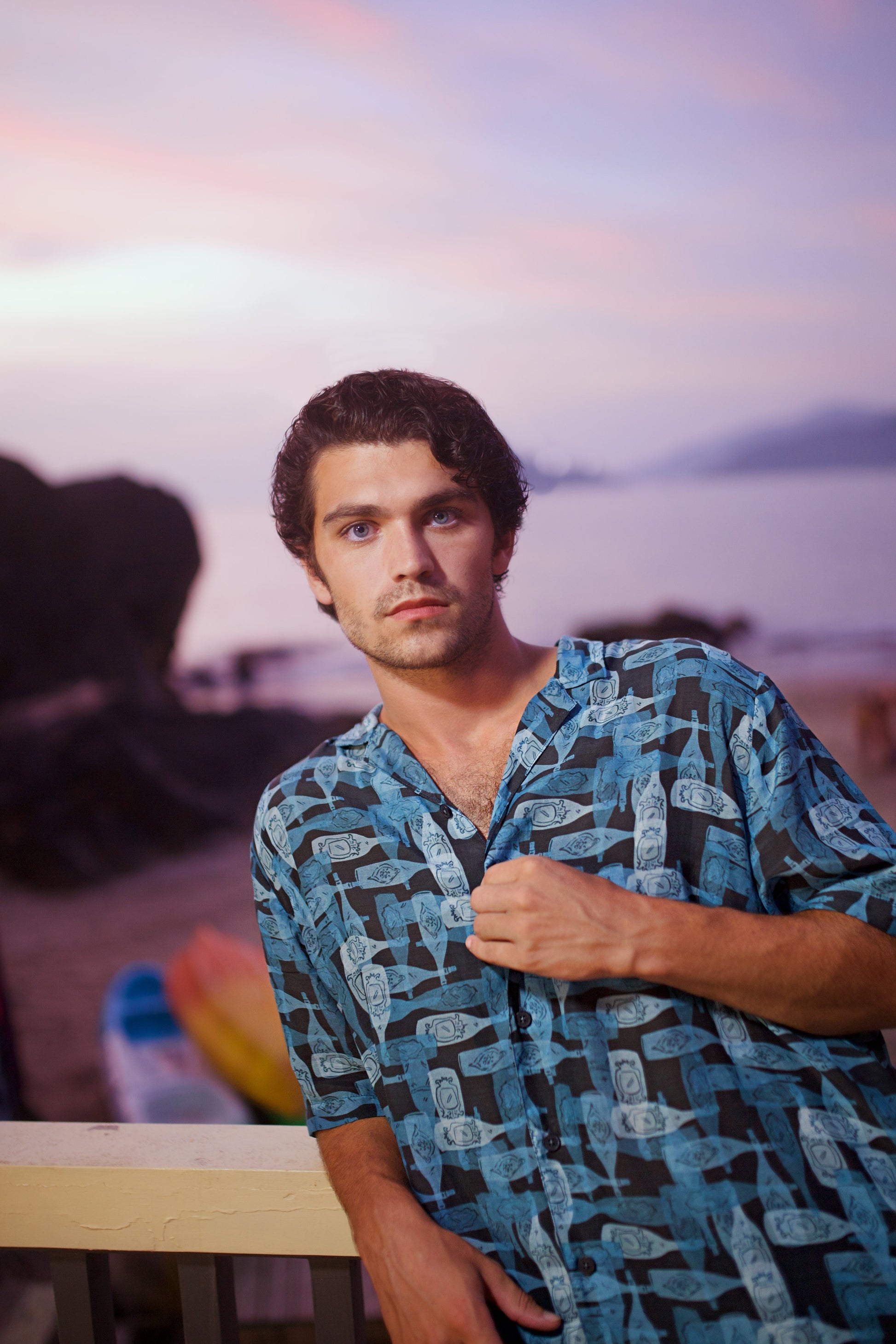 Men's trendy oversized button up shirt in blue with unique print, perfect for casual summer outings