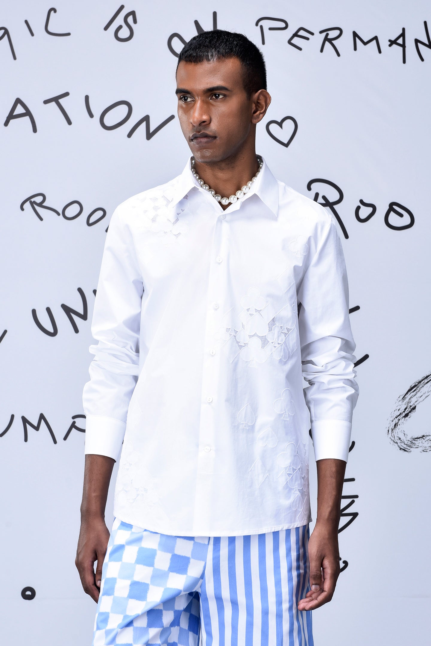 Men's trendy white shirt by Stylera with subtle floral patterns and classic collar