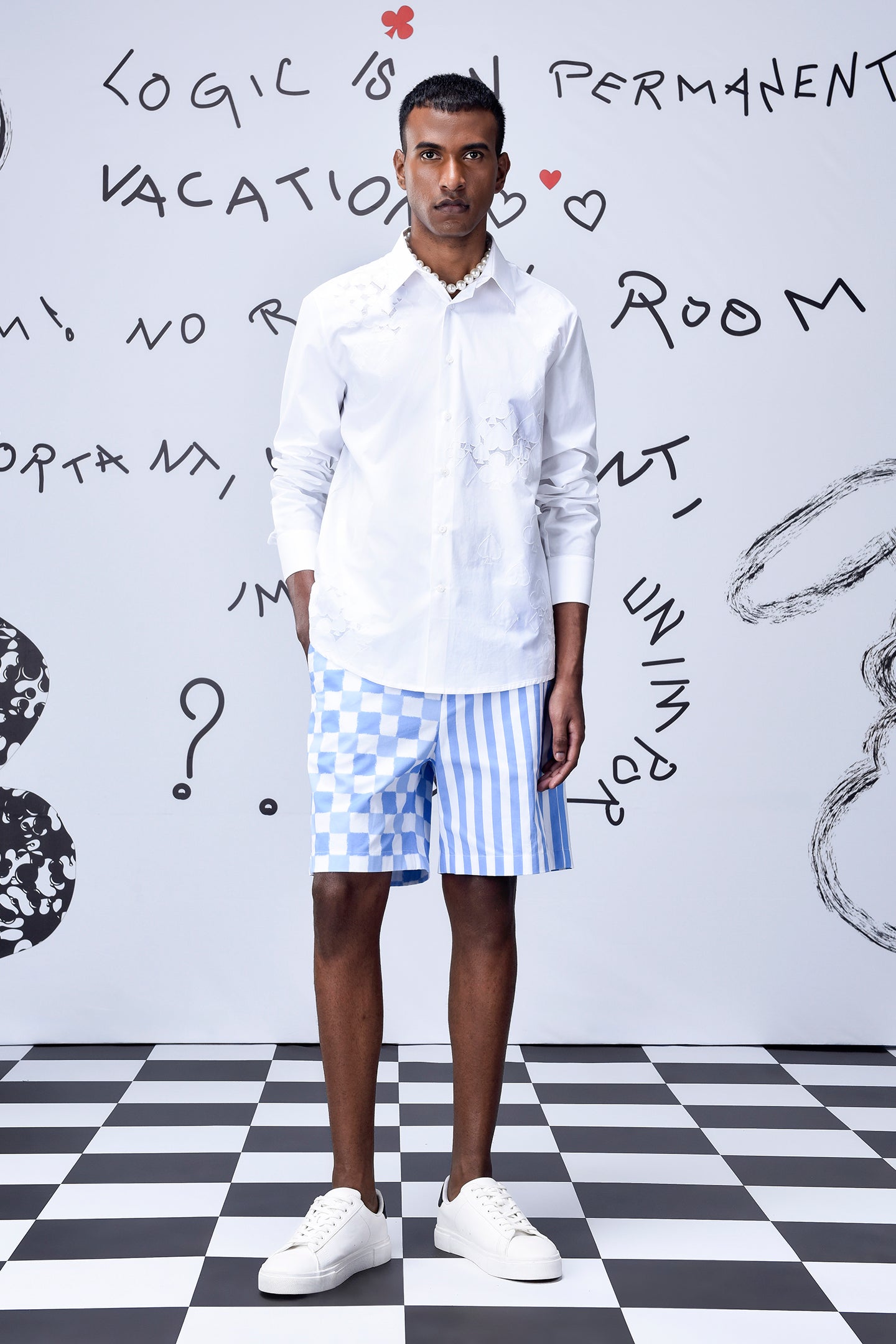 Men's trendy white shirt by Stylera worn with blue and white patterned shorts