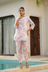 Pastel floral cotton co ord set featuring a vibrant tunic and matching pants, perfect for casual outings.