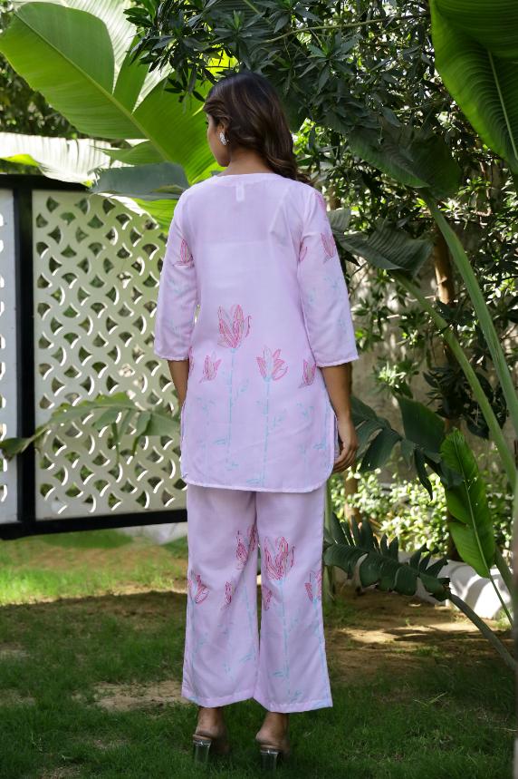 Pastel pink cotton co-ord set featuring floral designs, perfect for casual outings or relaxation