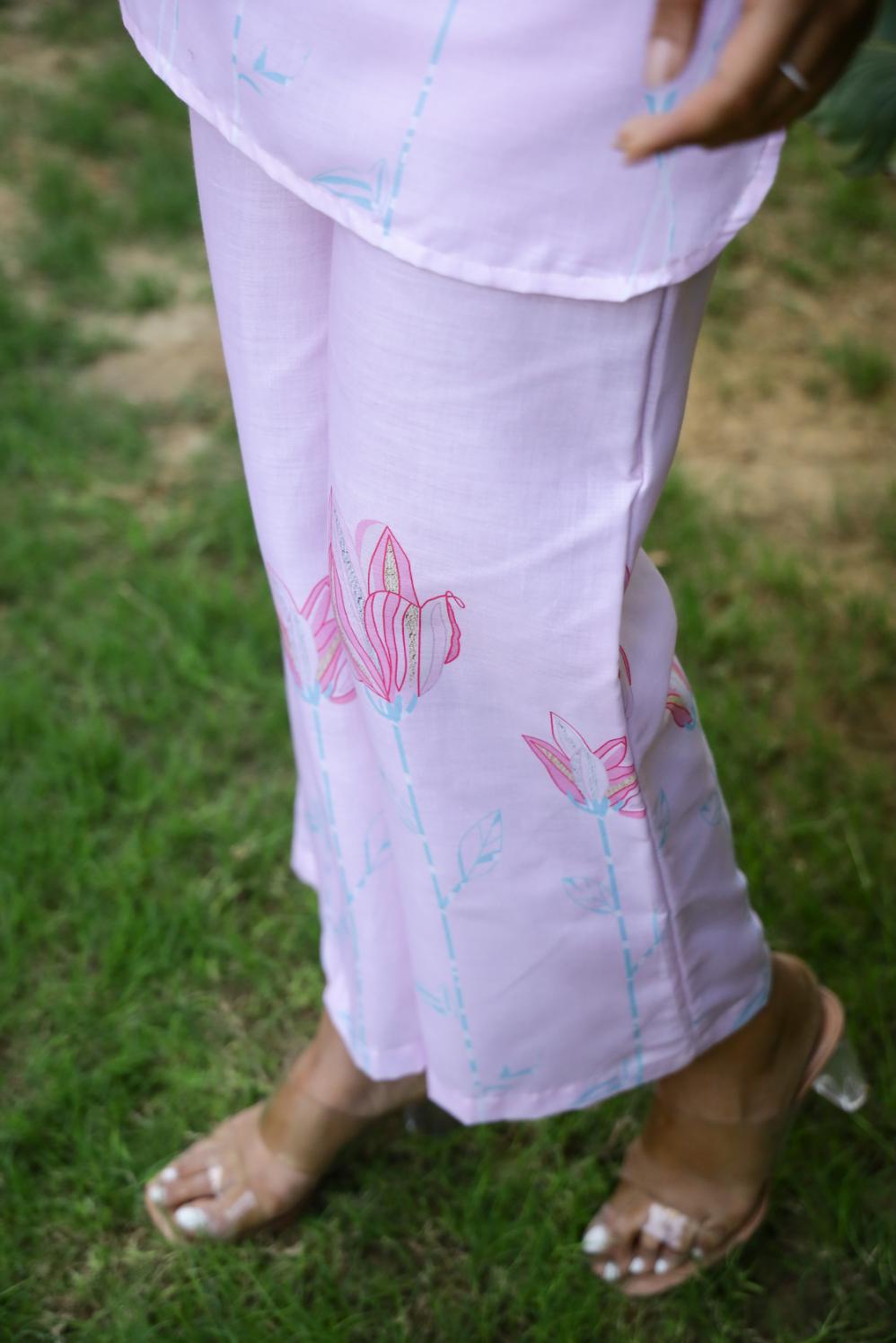Pastel pink cotton co-ord set featuring floral designs, perfect for casual summer outings