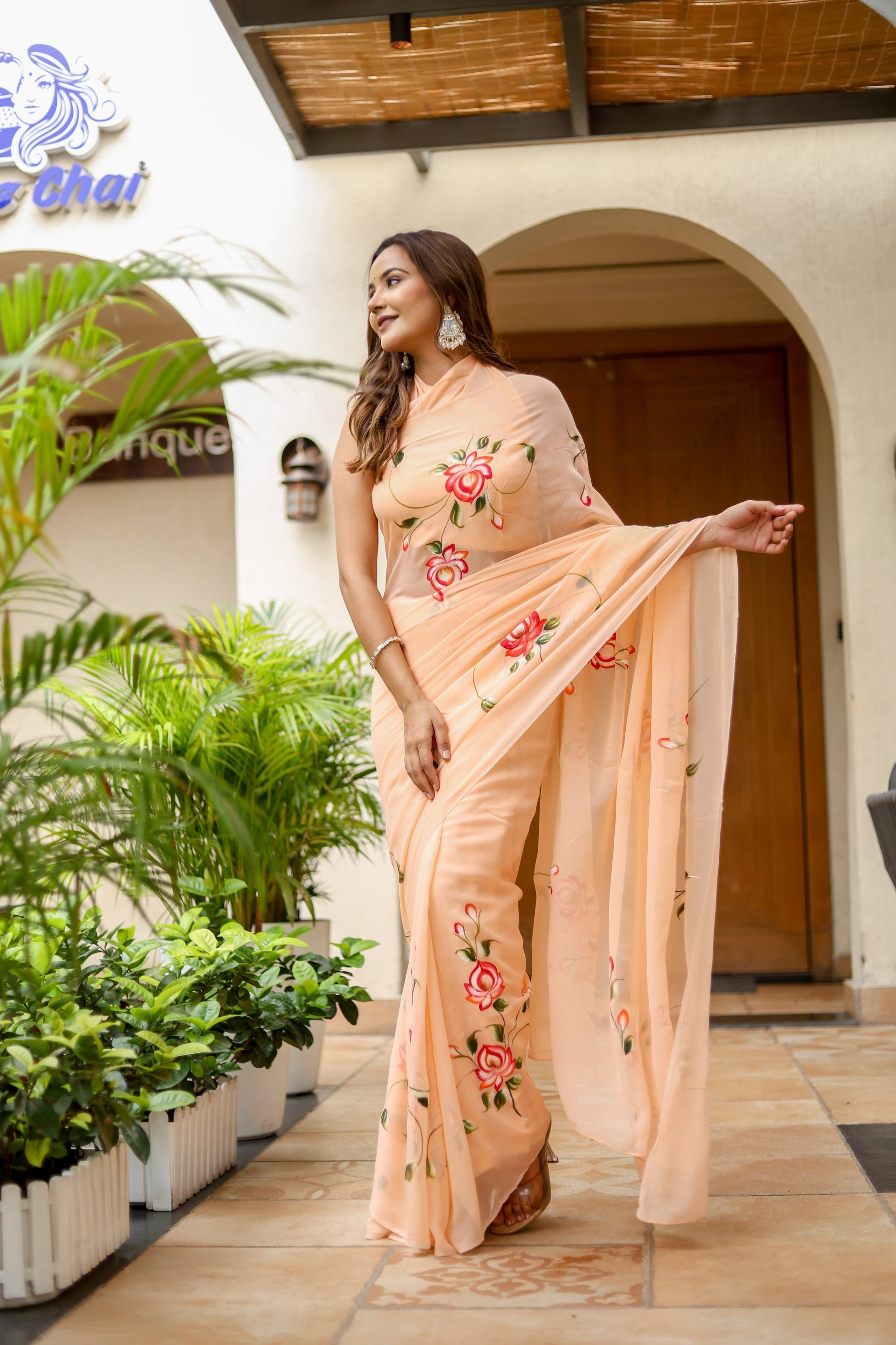 Elegant peach floral saree for women with intricate rose embroidery and a matching dupatta.