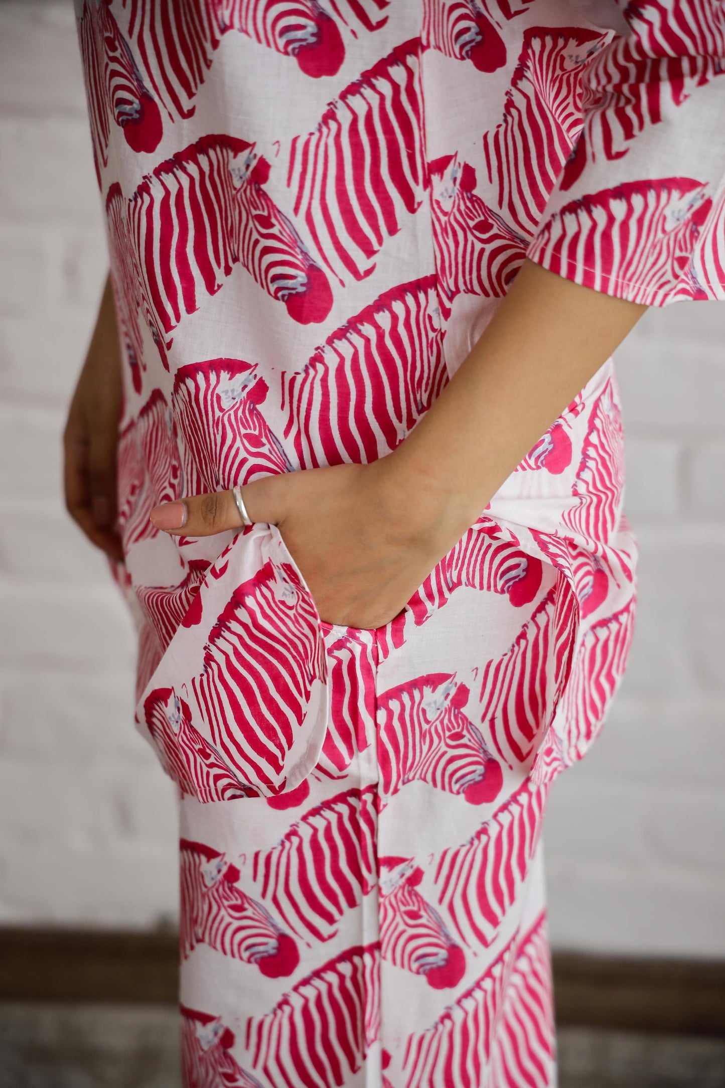 Stylish pink cotton matching set for women featuring a zebra print design and comfortable pockets