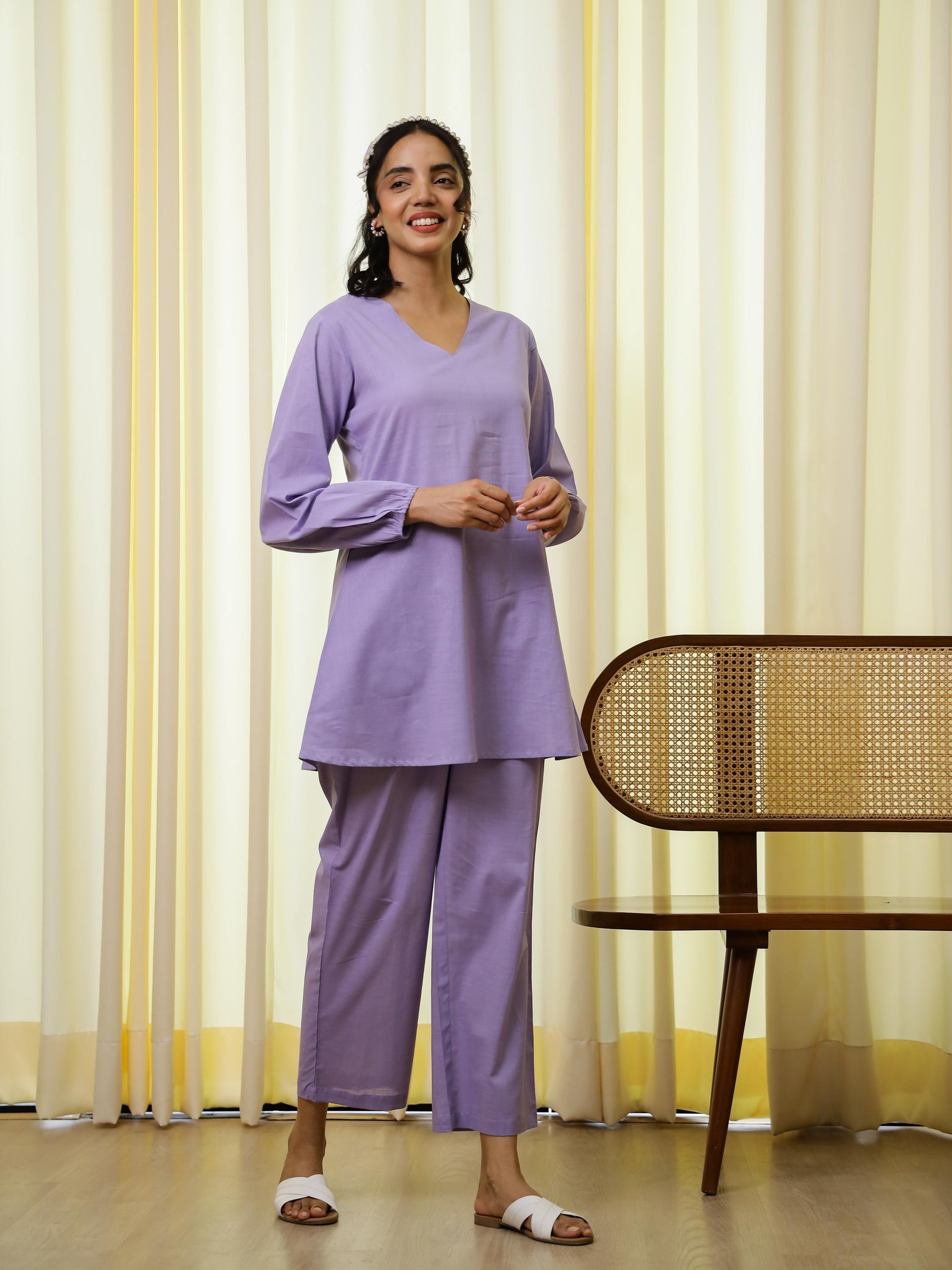Model wearing a purple cotton co-ord set for women, featuring a V-neck tunic and matching pants