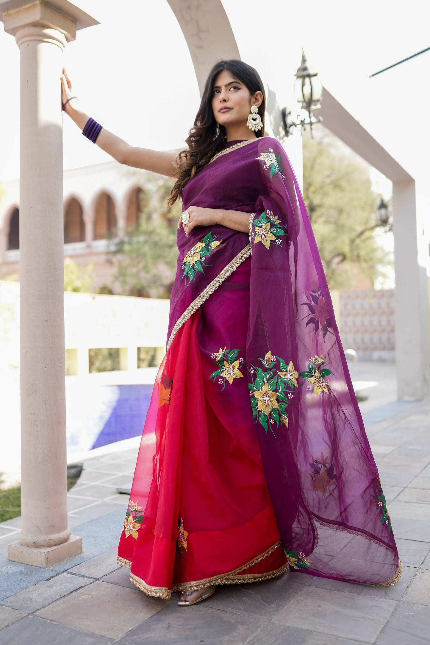 Elegant red and purple saree with handwork featuring floral designs, perfect for festive occasions.