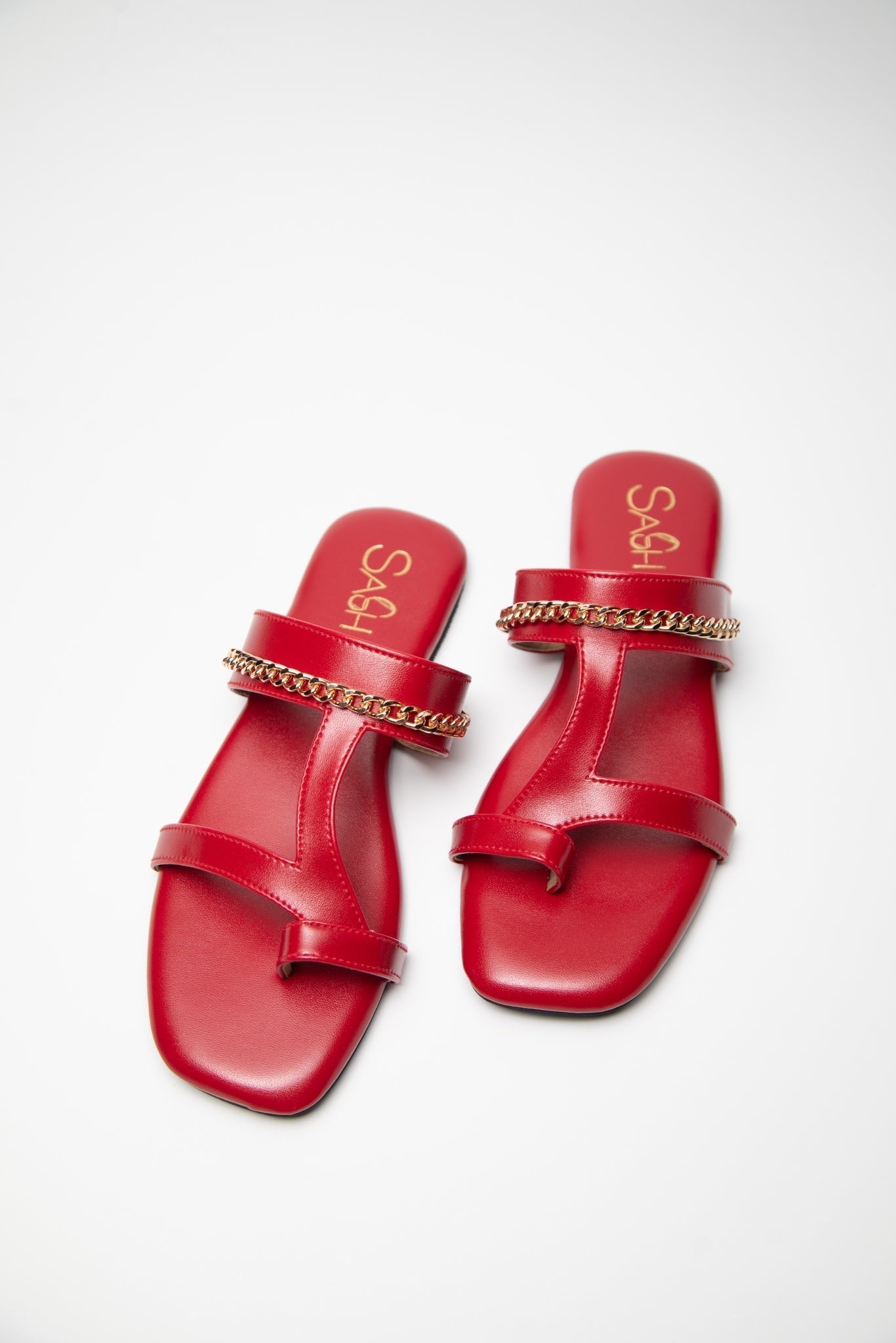 Stylera stylish red flat sandals with gold chain detail on smooth leather straps
