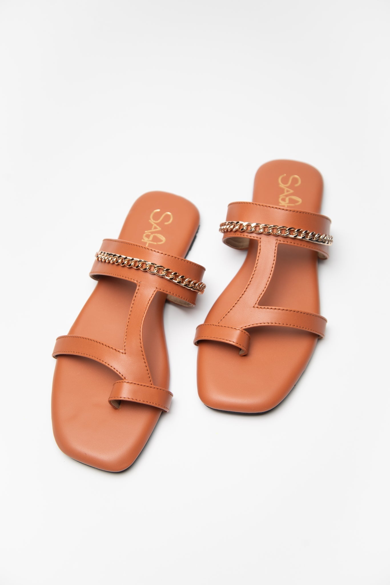 Stylera trendy tan flats for women with double straps and chain detail on white background