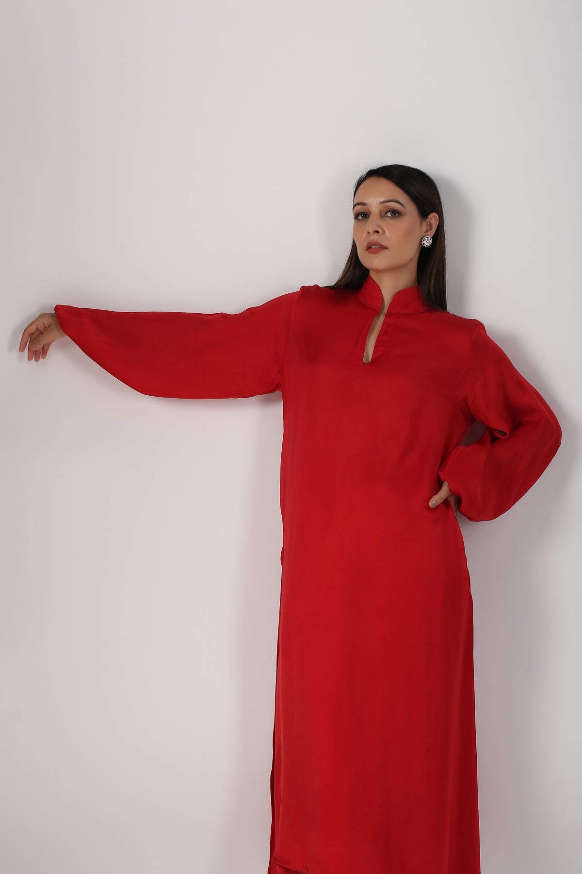 Elegant red satin kurta with pants for women featuring a chic neckline and long sleeves