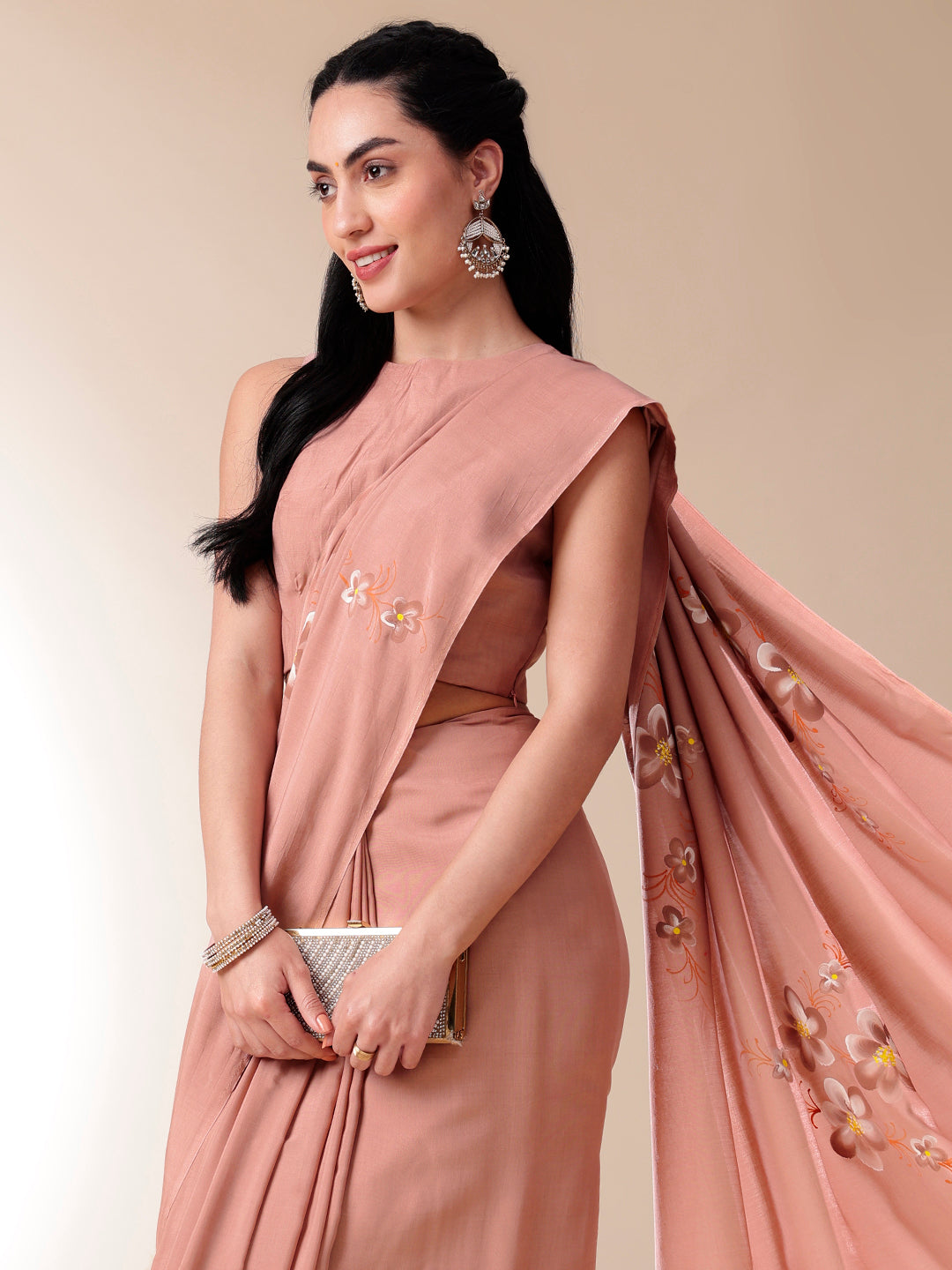 Elegant soft cotton saree with floral design, styled with accessories for a sophisticated look