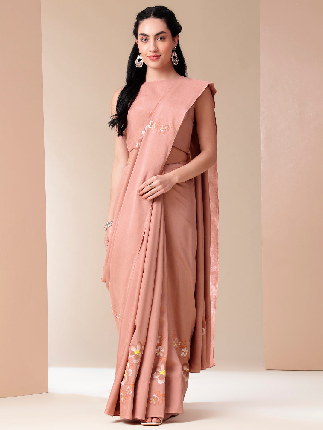 Elegant Stylera soft cotton saree with floral design in pastel pink, perfect for festive occasions