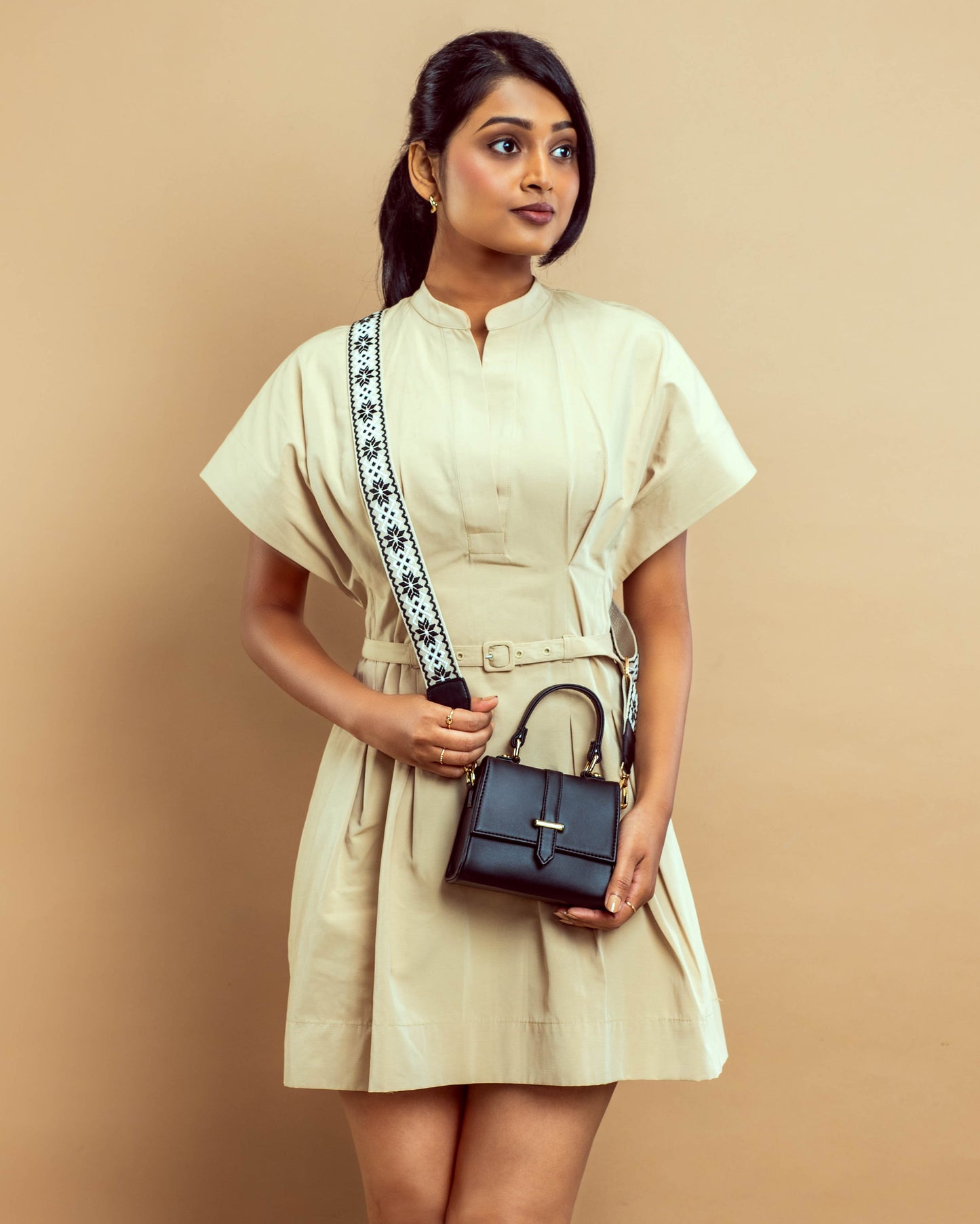 Stylish small shoulder bag for women by Stylera, paired perfectly with a chic beige dress