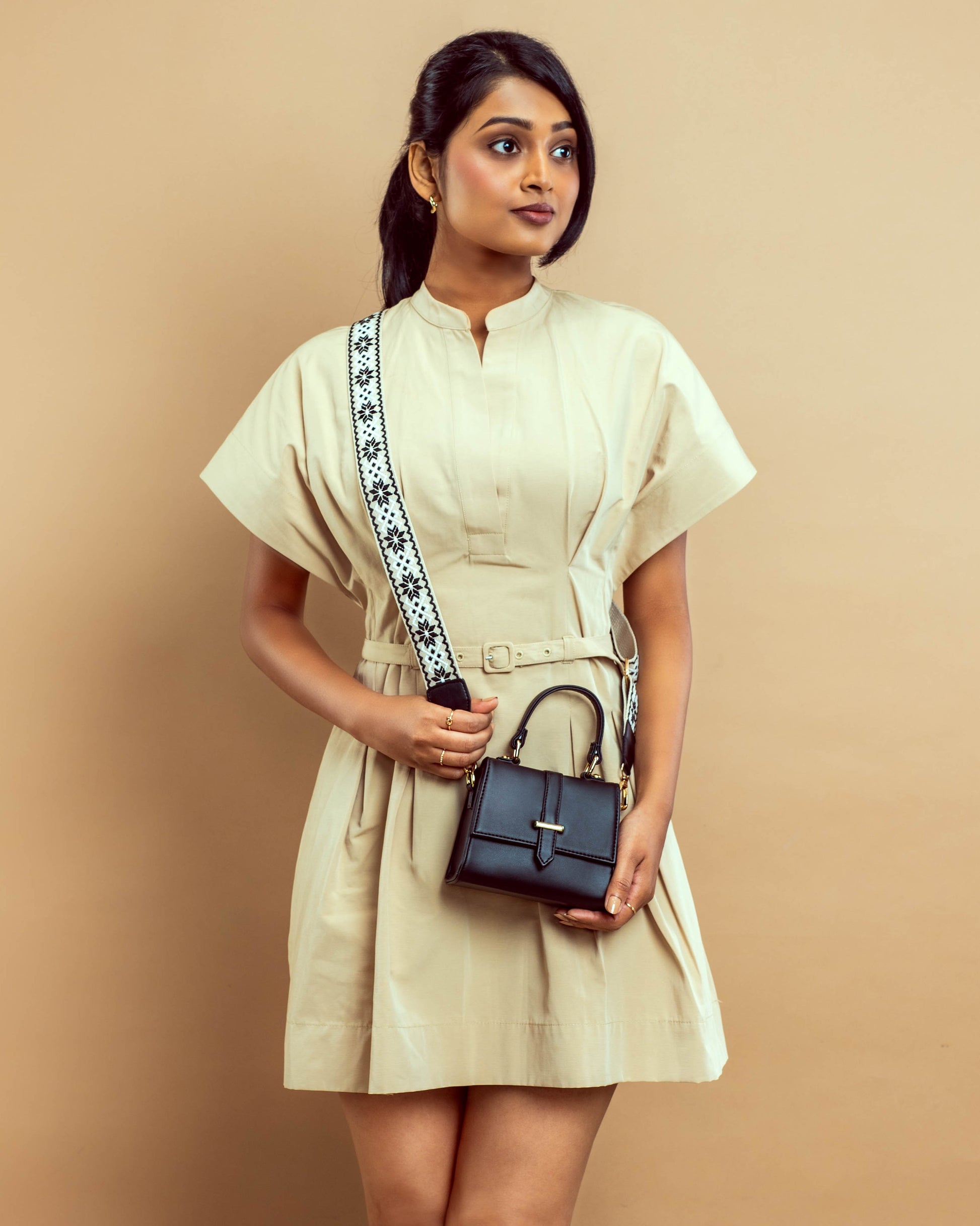 Stylish small shoulder bag for women by Stylera, paired perfectly with a chic beige dress