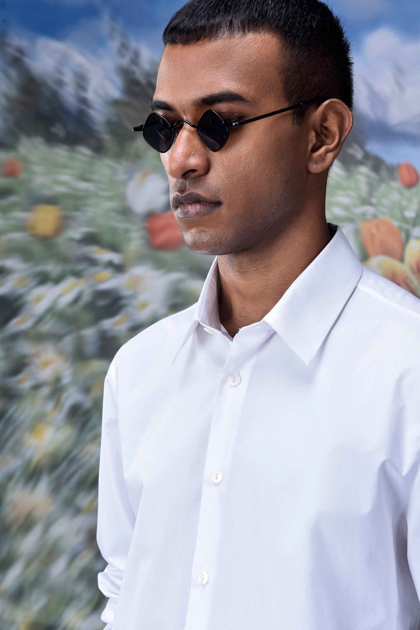 Stylish white shirt for men by Stylera worn by a man with black sunglasses
