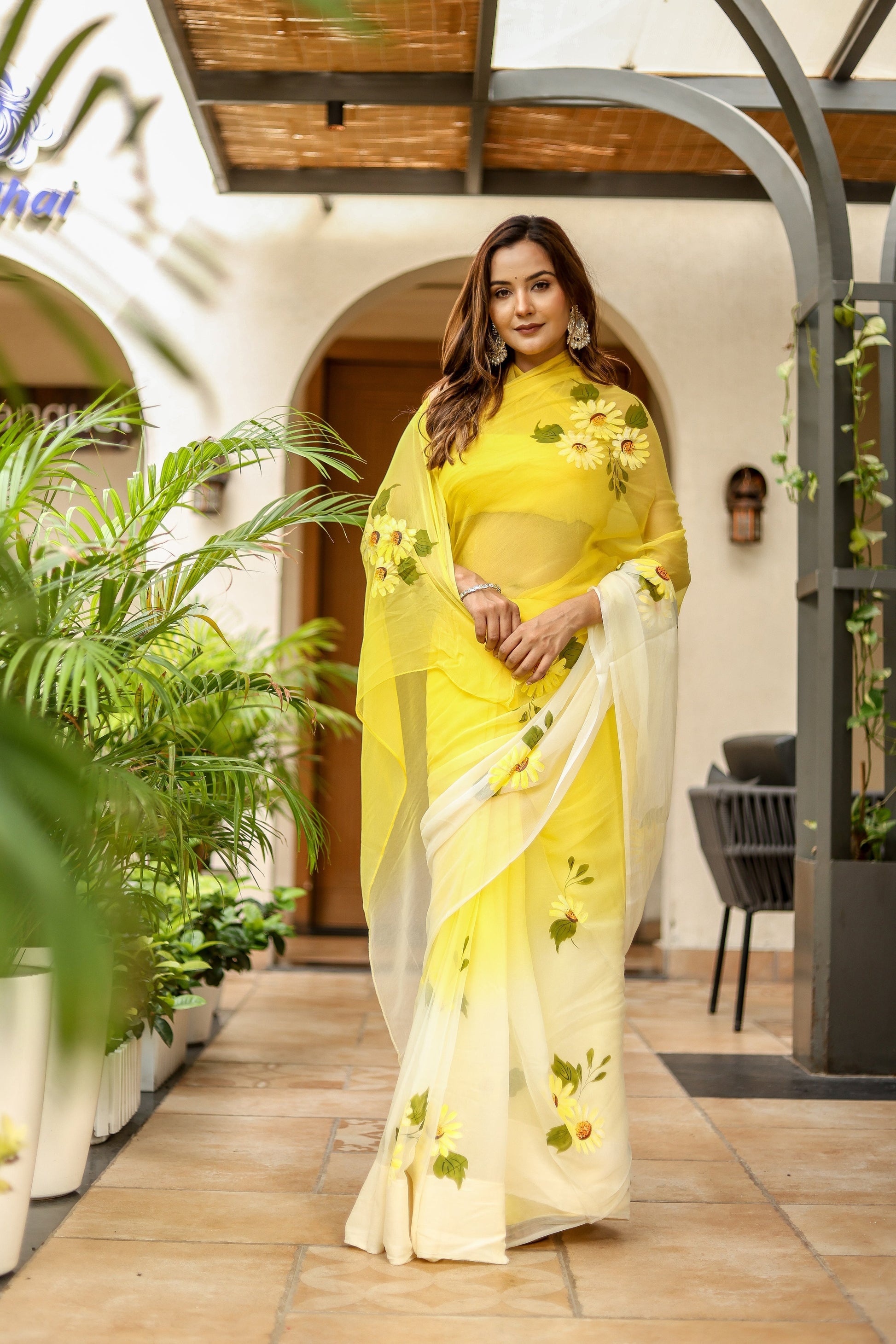 Elegant sunflower saree for women in yellow with floral accents for special occasions