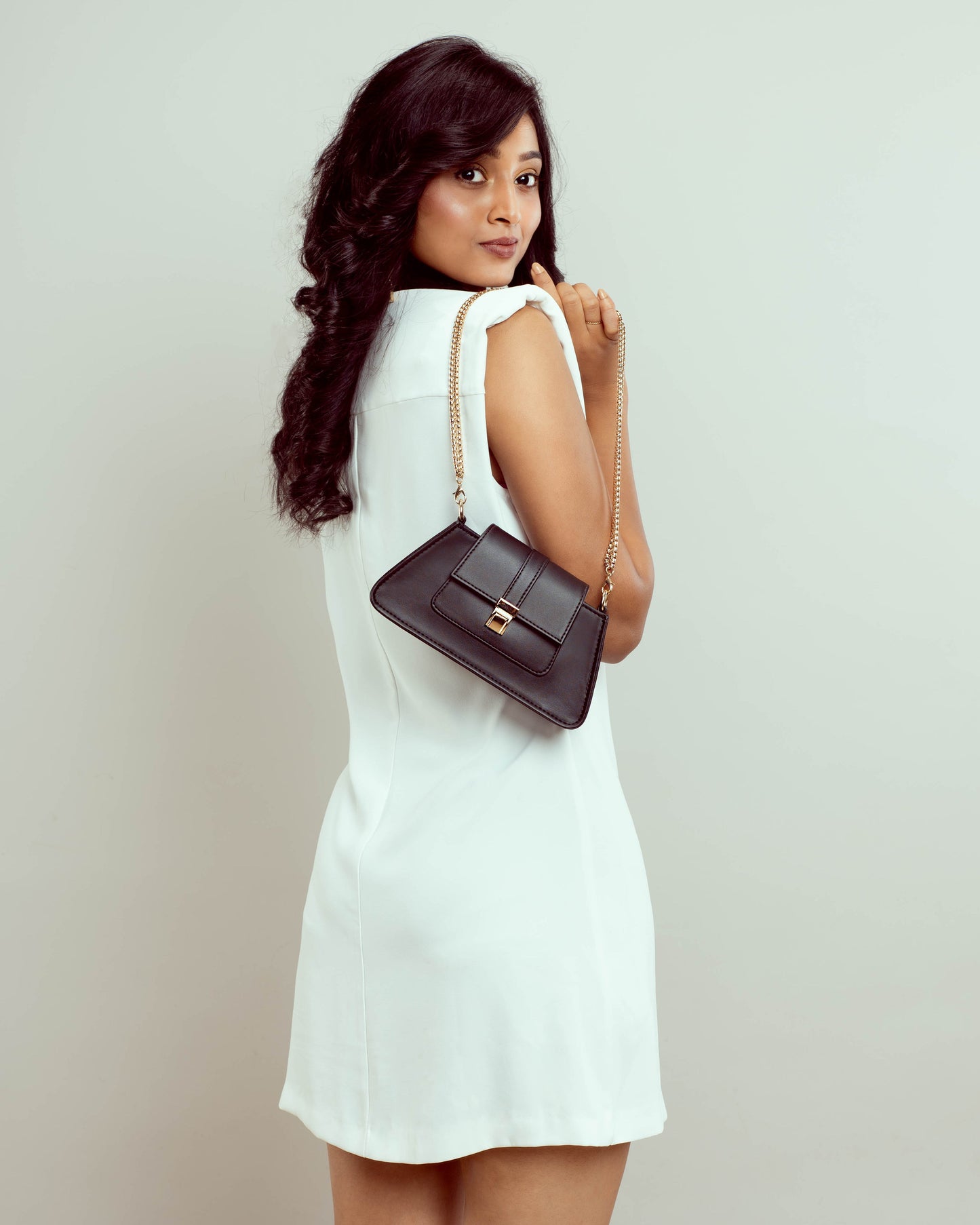 Trendy black shoulder bag for women with a stylish design and chain strap, perfect for any outfit
