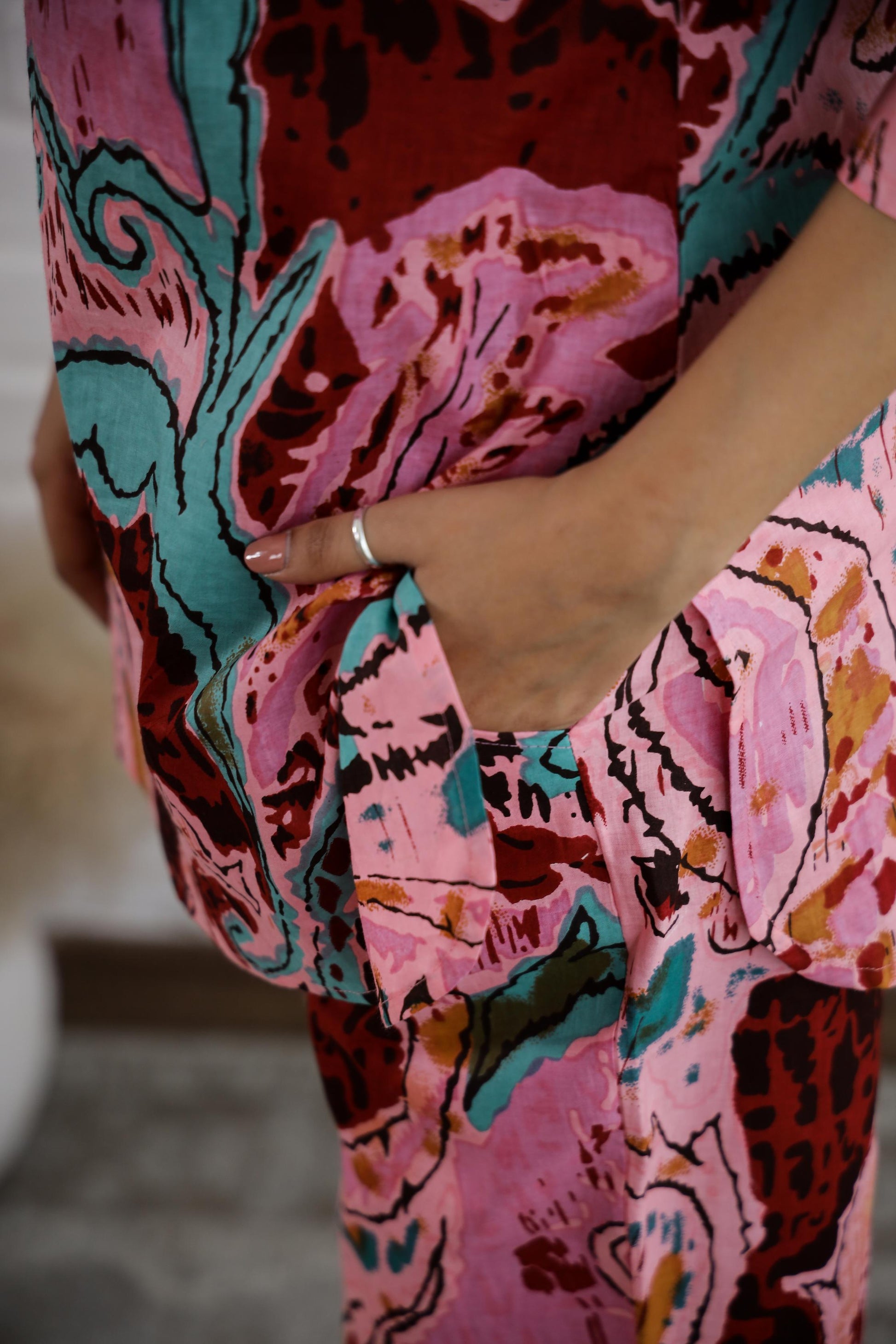 Trendy cotton two piece outfit in vibrant floral print with stylish pockets and relaxed fit