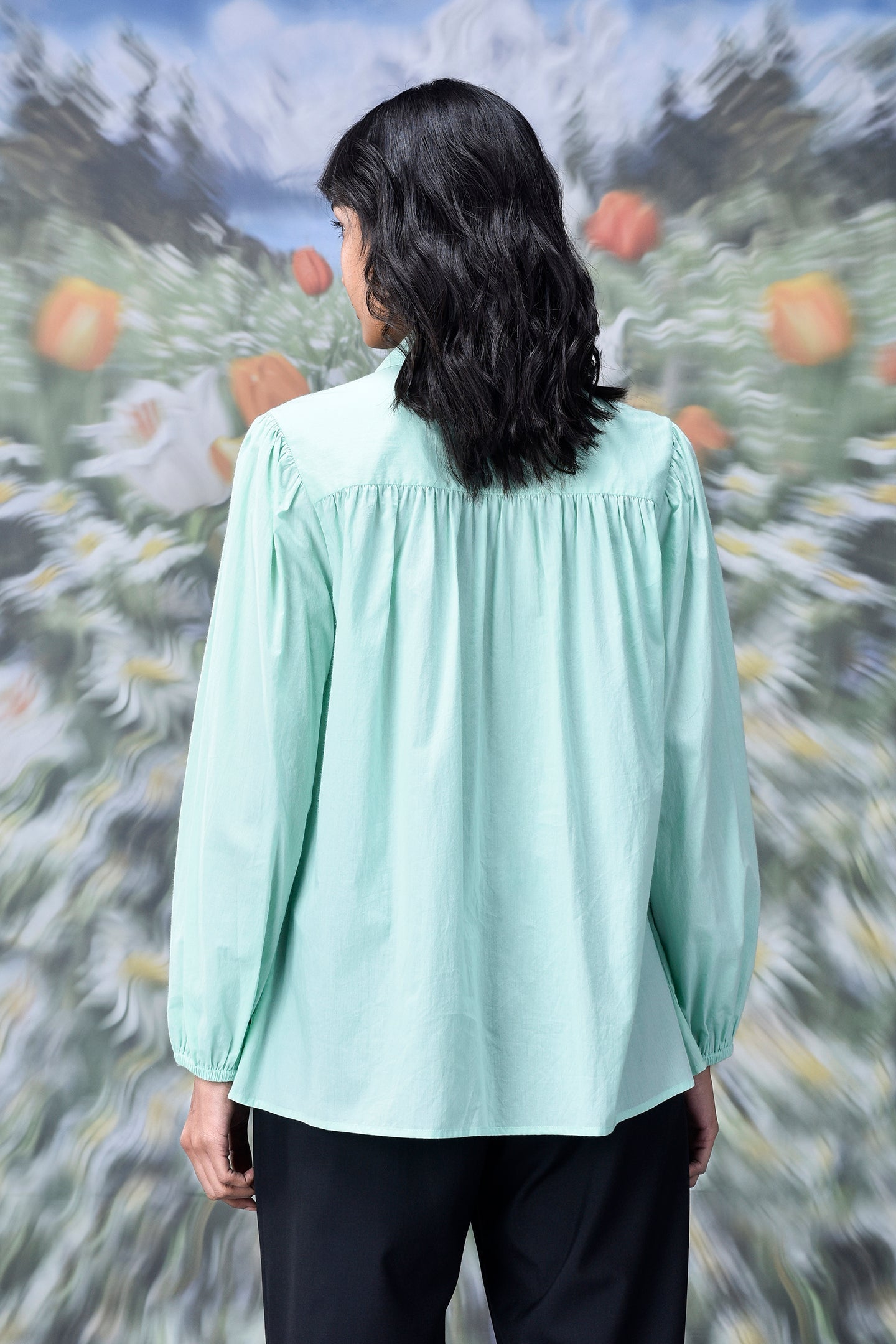 Stylera mint green long sleeve shirt back view on model trendy loose fit women's top with gathered yoke relaxed fit