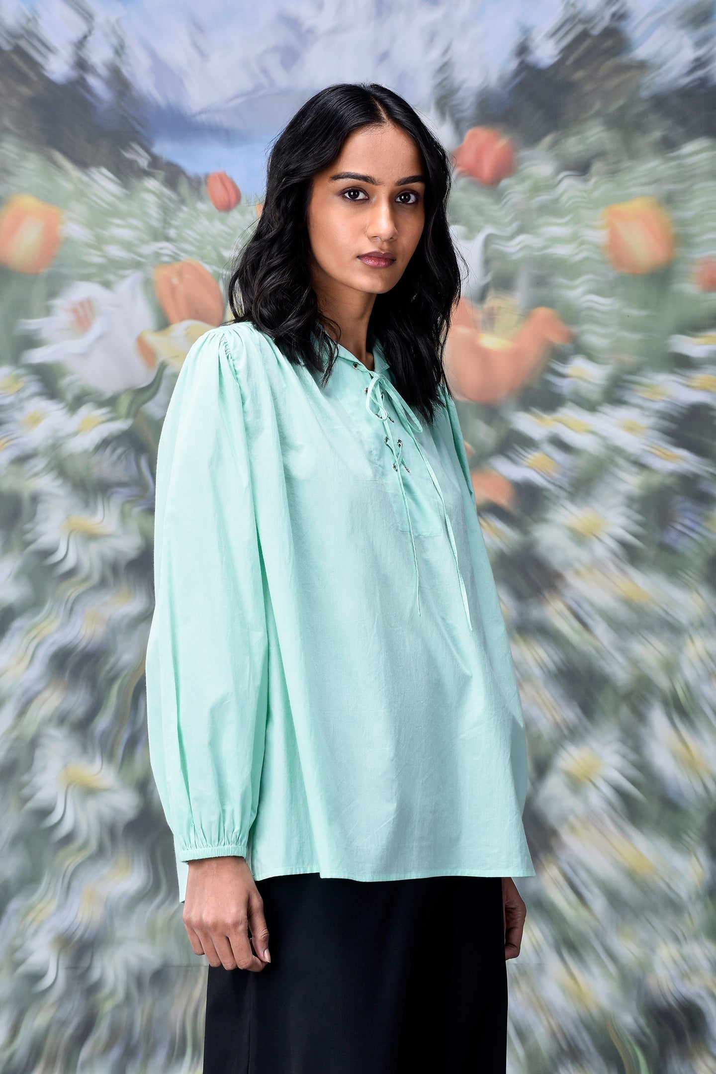 Stylera mint green blouse modeled as a trendy loose fit women's top with long sleeves