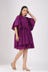 Trendy purple mini dress with a round neckline and billowy sleeves, perfect for casual outings