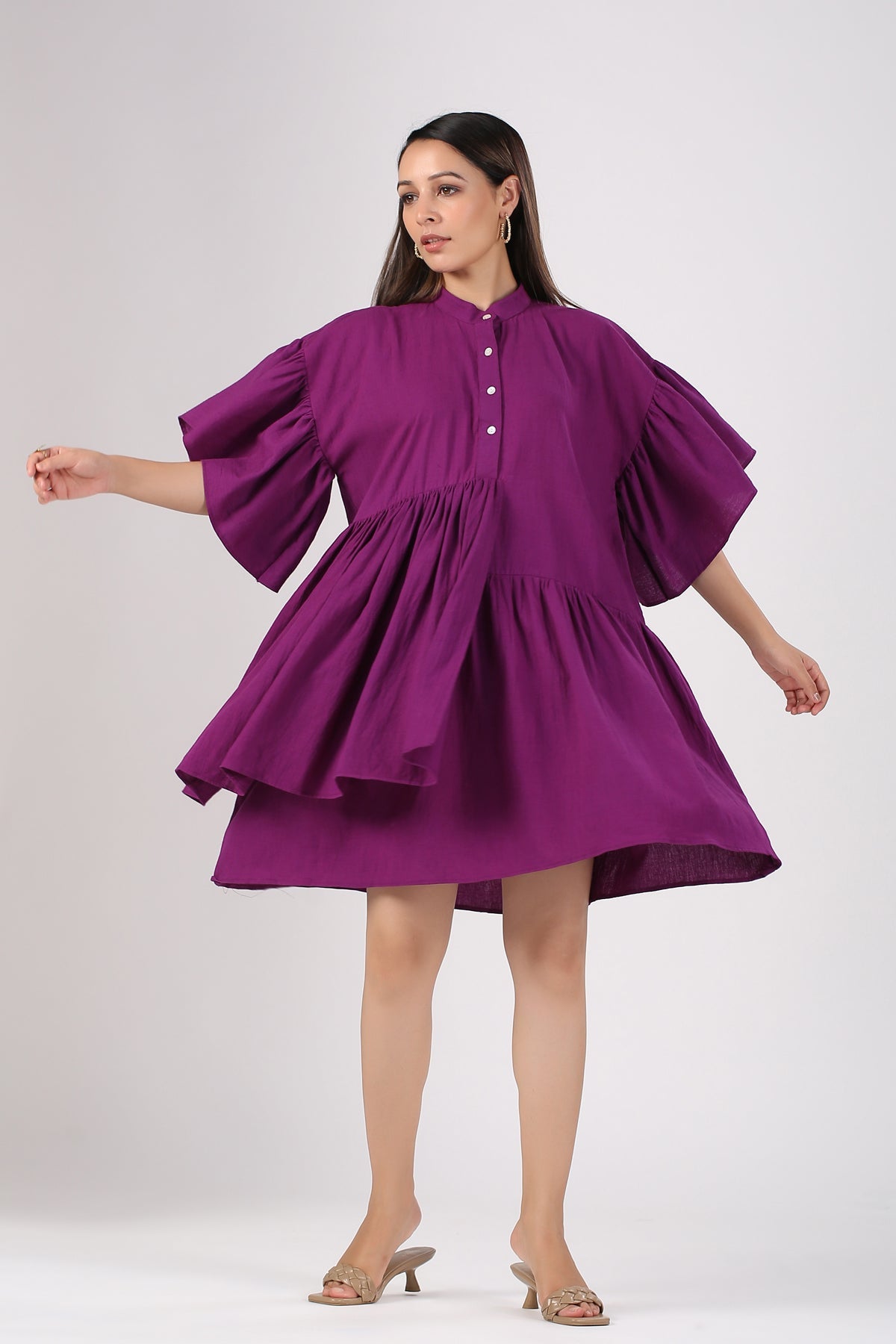 Trendy purple mini dress with puff sleeves and button details, perfect for stylish summer outings