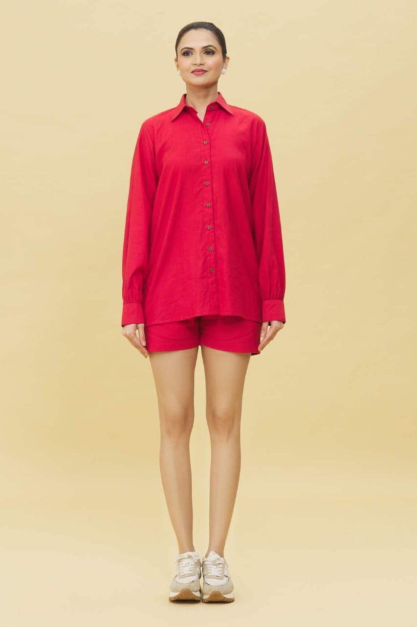 Model wearing trendy red matching shorts and shirt set long sleeve button shirt with shorts