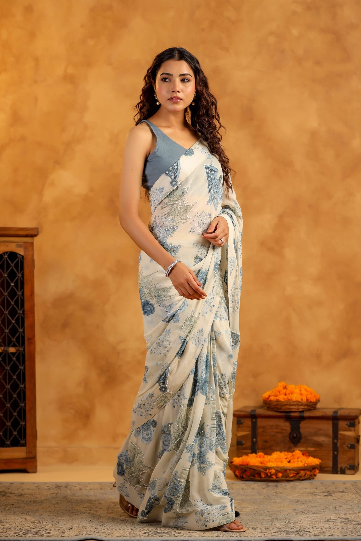 Stylera trendy saree with blouse set white and blue printed saree with sleeveless blue blouse modeled for festive occasions