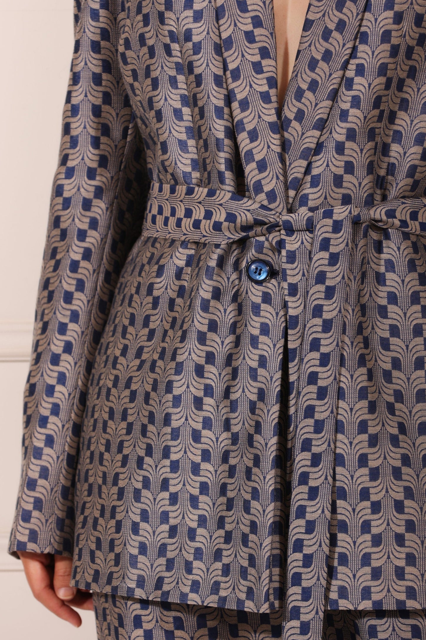 Trendy two piece pant suit women with stylish patterned fabric and a belted blazer design