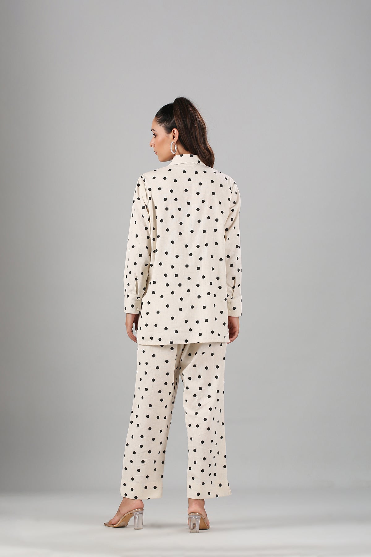 Stylera two piece outfit polka dots cream blazer and straight leg pants back view on model wearing heels