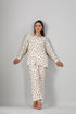 Stylera cream two piece outfit polka dots long sleeve button shirt with matching relaxed pants on model