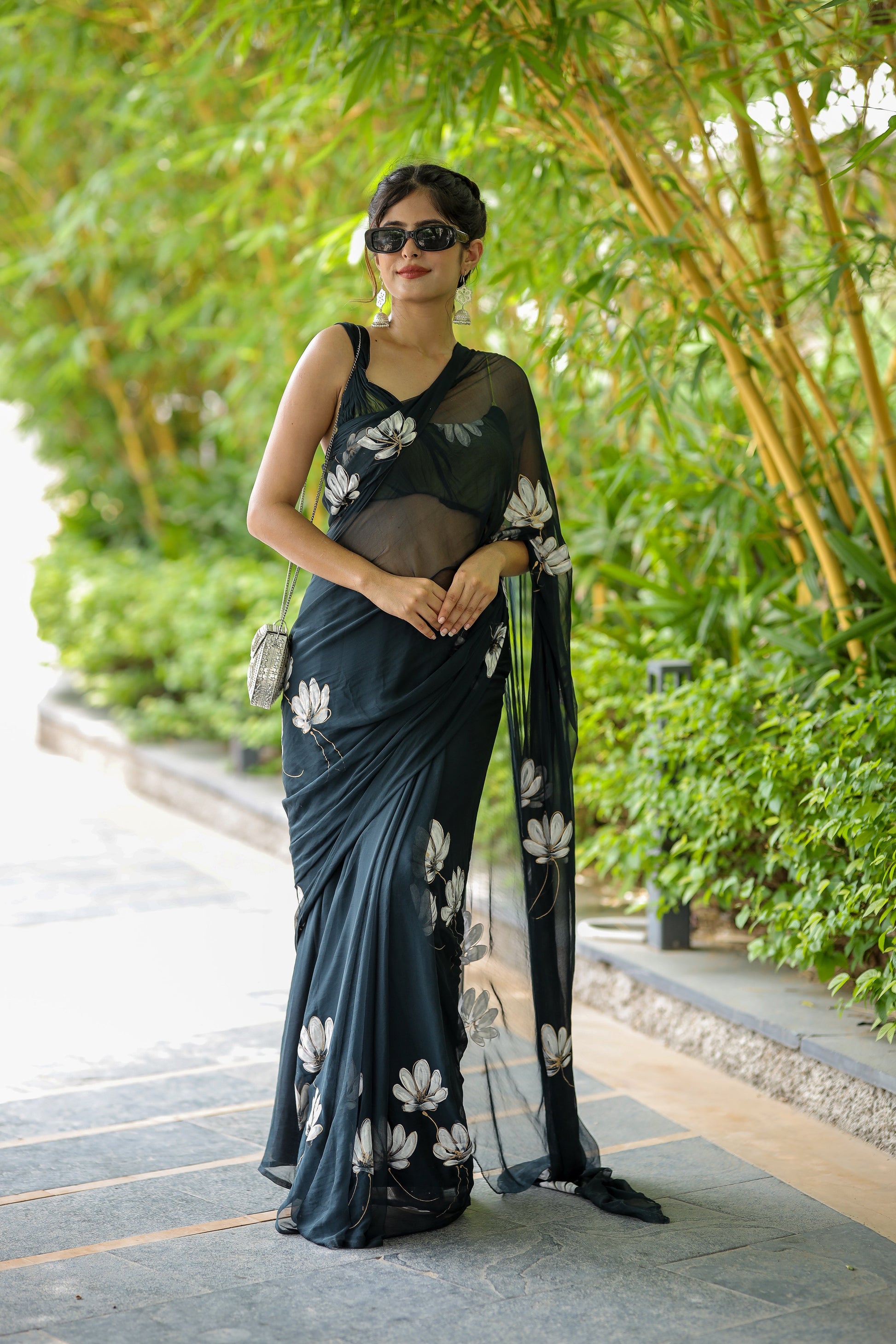 Elegant unique black saree for party wear with floral design and stylish drape