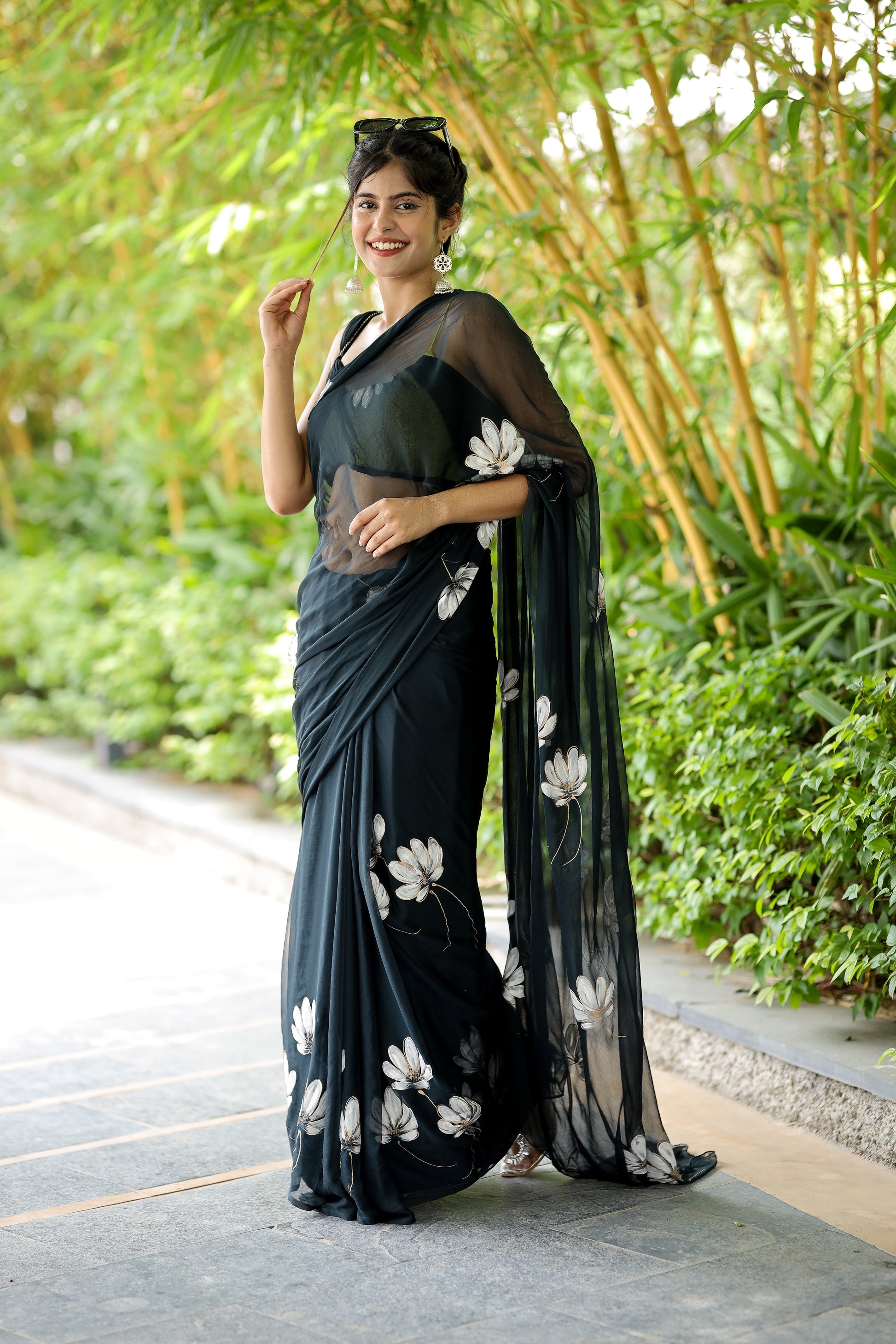 Elegant unique black saree for party wear with floral designs, perfect for special occasions.