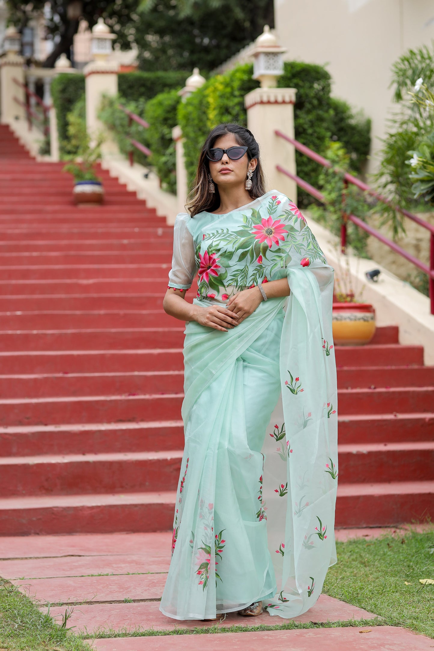 Unique designer organza saree in mint green with floral embroidery, perfect for special occasions