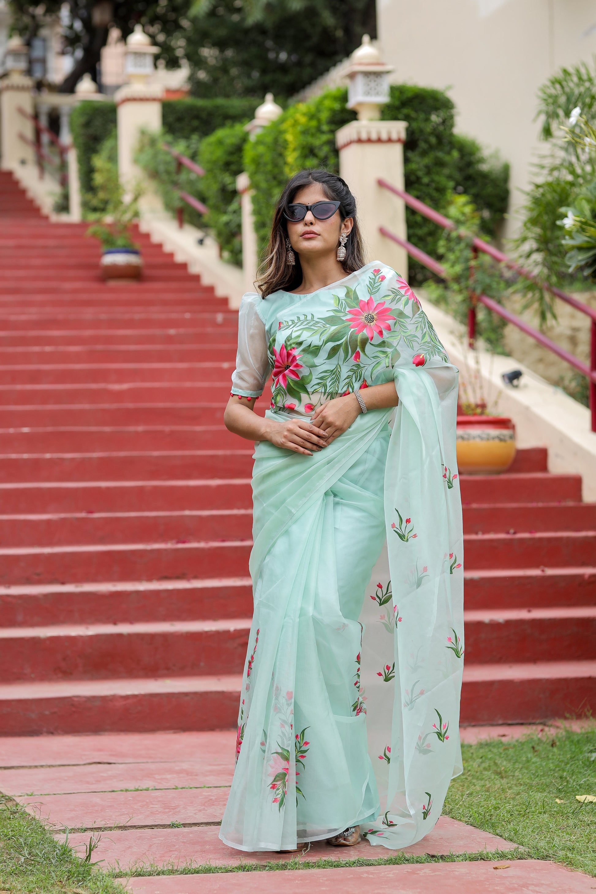Unique designer organza saree in mint green with floral embroidery, perfect for special occasions