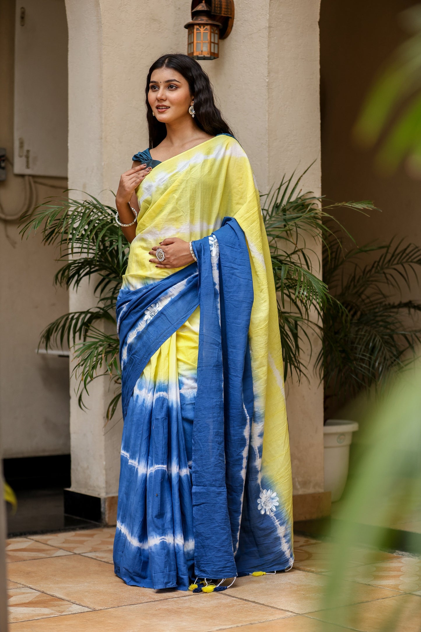 Unique designer saree for women in yellow and blue with a stylish tie-dye pattern