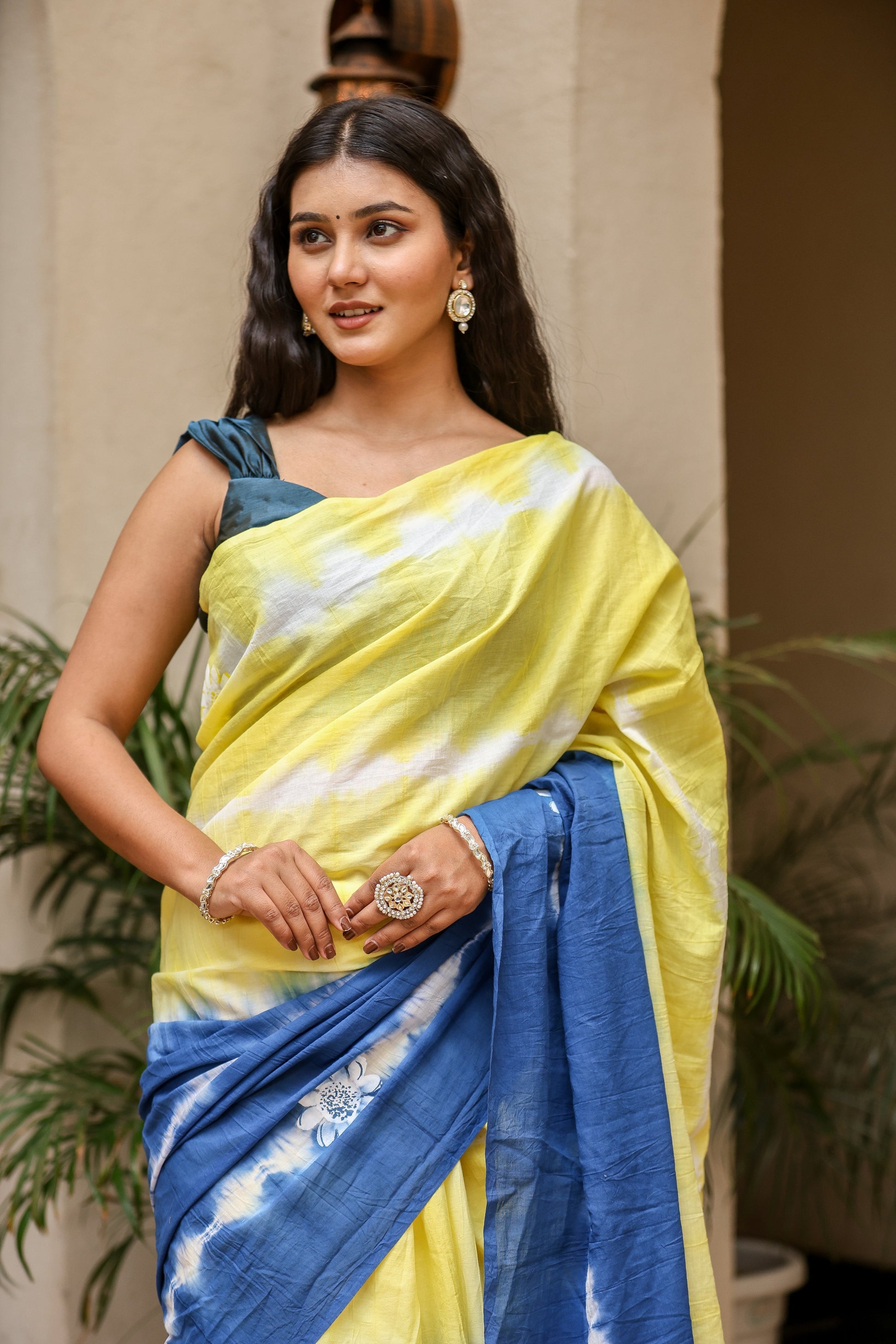 Elegant unique designer saree for women in yellow and blue with elegant drape and modern styling