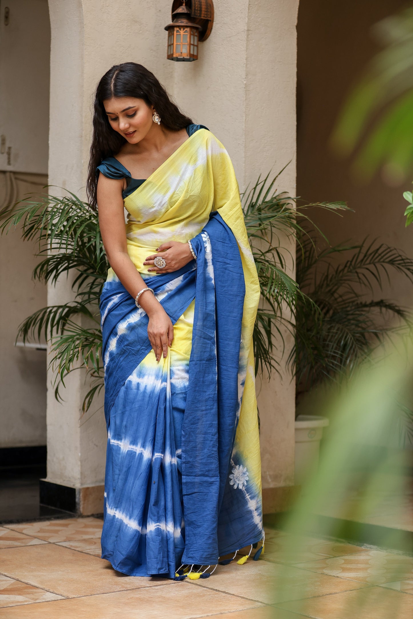 Unique designer saree for women in blue and yellow with elegant tie-dye patterns and stylish draping